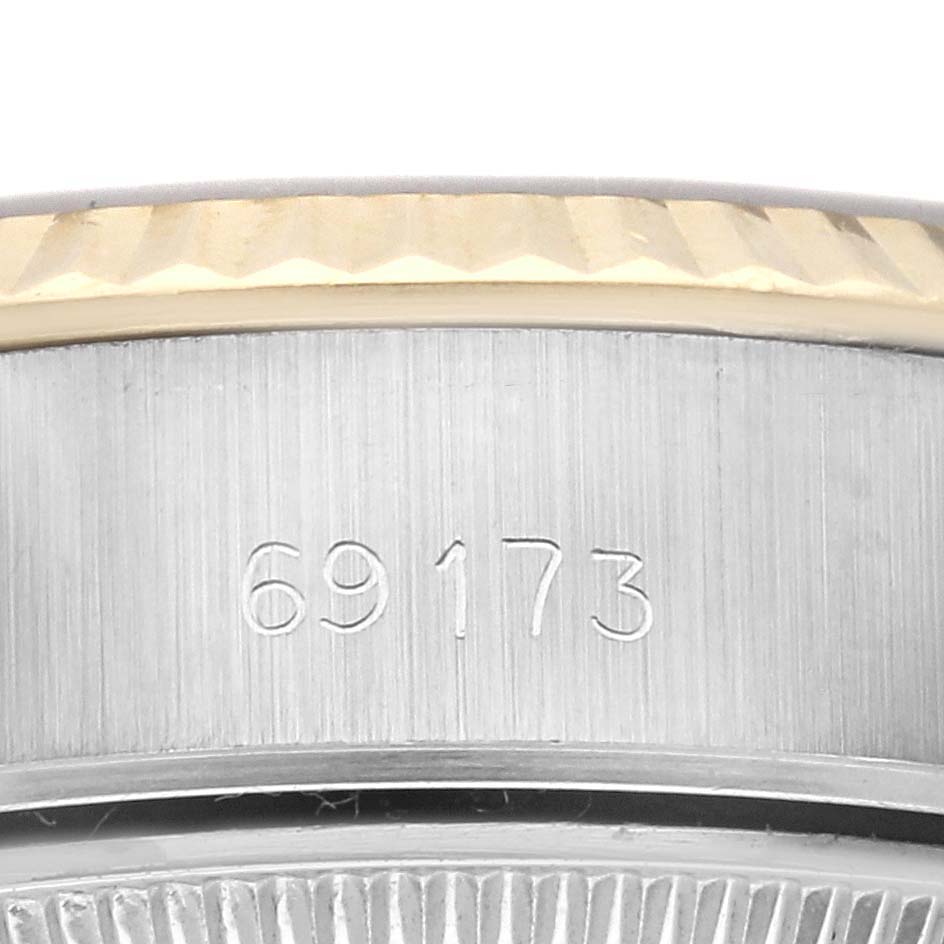 The image shows a close-up of the case side and bezel of a Rolex Datejust 69173 Women
s Steel and Gold (two tone) Champagne Dial 69173 Women
s Steel and Gold (two tone) Champagne Dial model, featuring the model number 69173.