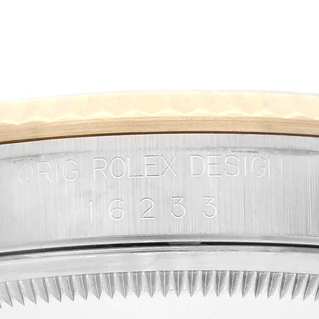 This image shows a close-up of the side of a Rolex Datejust 16233 Men's Steel and Gold (two tone) Champagne Dial 16233 Men's Steel and Gold (two tone) Champagne Dial watch, including the bezel and casing.