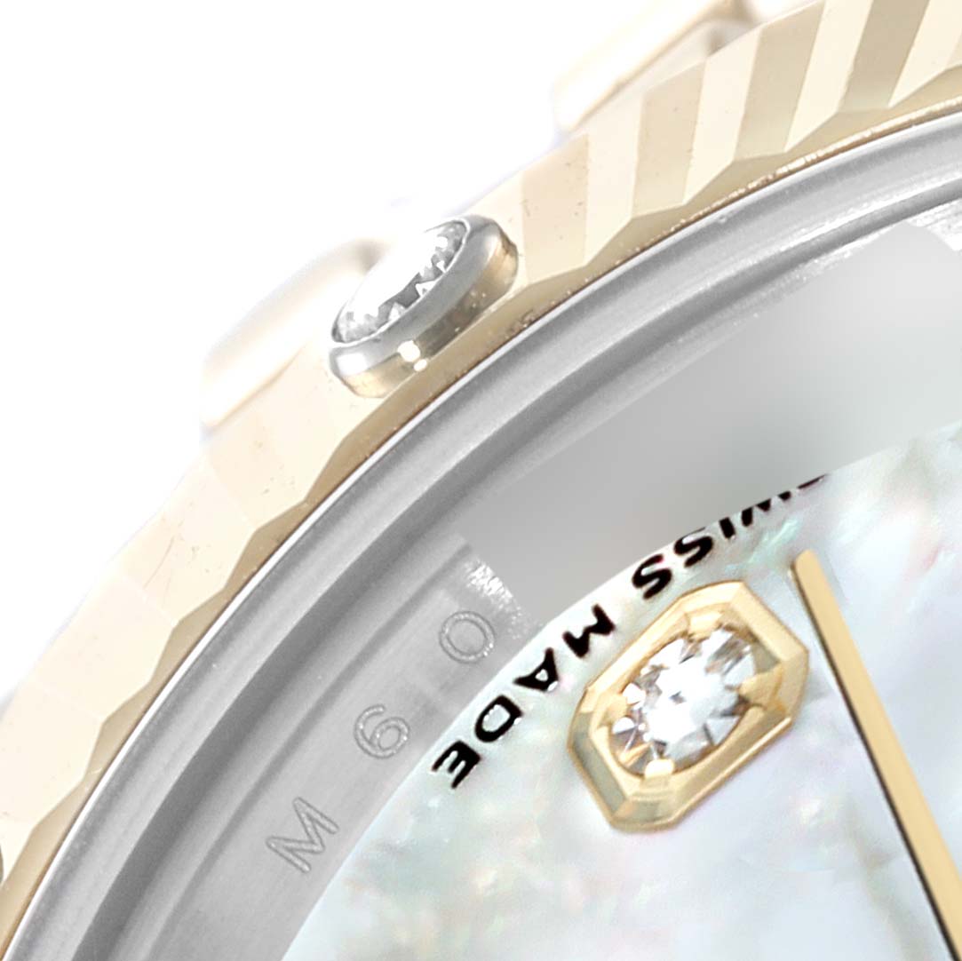 The image shows a close-up angle of the bezel, dial, and diamond marker of a Rolex Datejust 179313 Women
s Steel and Gold (two tone) Mother of Pearl Dial 179313 Women
s Steel and Gold (two tone) Mother of Pearl Dial watch.