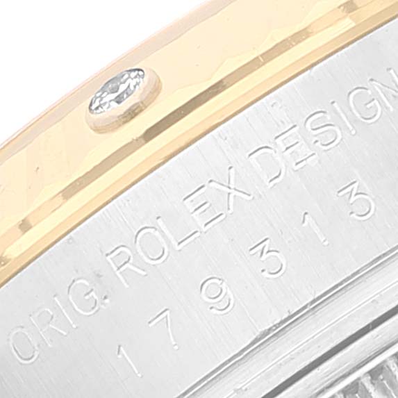 This is a close-up view of the side detailing and engraved model number of the Rolex Datejust 179313 Women
s Steel and Gold (two tone) Mother of Pearl Dial 179313 Women
s Steel and Gold (two tone) Mother of Pearl Dial watch.