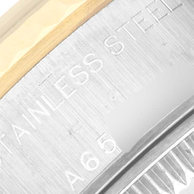 This close-up image shows the detailed engraving on the stainless steel case back of a Rolex Datejust 79173 Women
s Steel and Gold (two tone) Mother of Pearl Dial 79173 Women
s Steel and Gold (two tone) Mother of Pearl Dial watch.