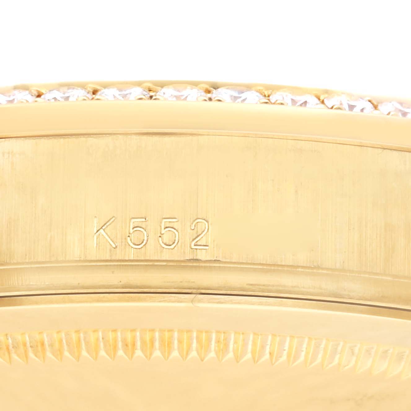 This image shows a close-up of the side of the Rolex President 118348 Men
s Yellow Gold Champagne Dial 118348 Men
s Yellow Gold Champagne Dial model watch, focusing on its serial number and part of the bezel.