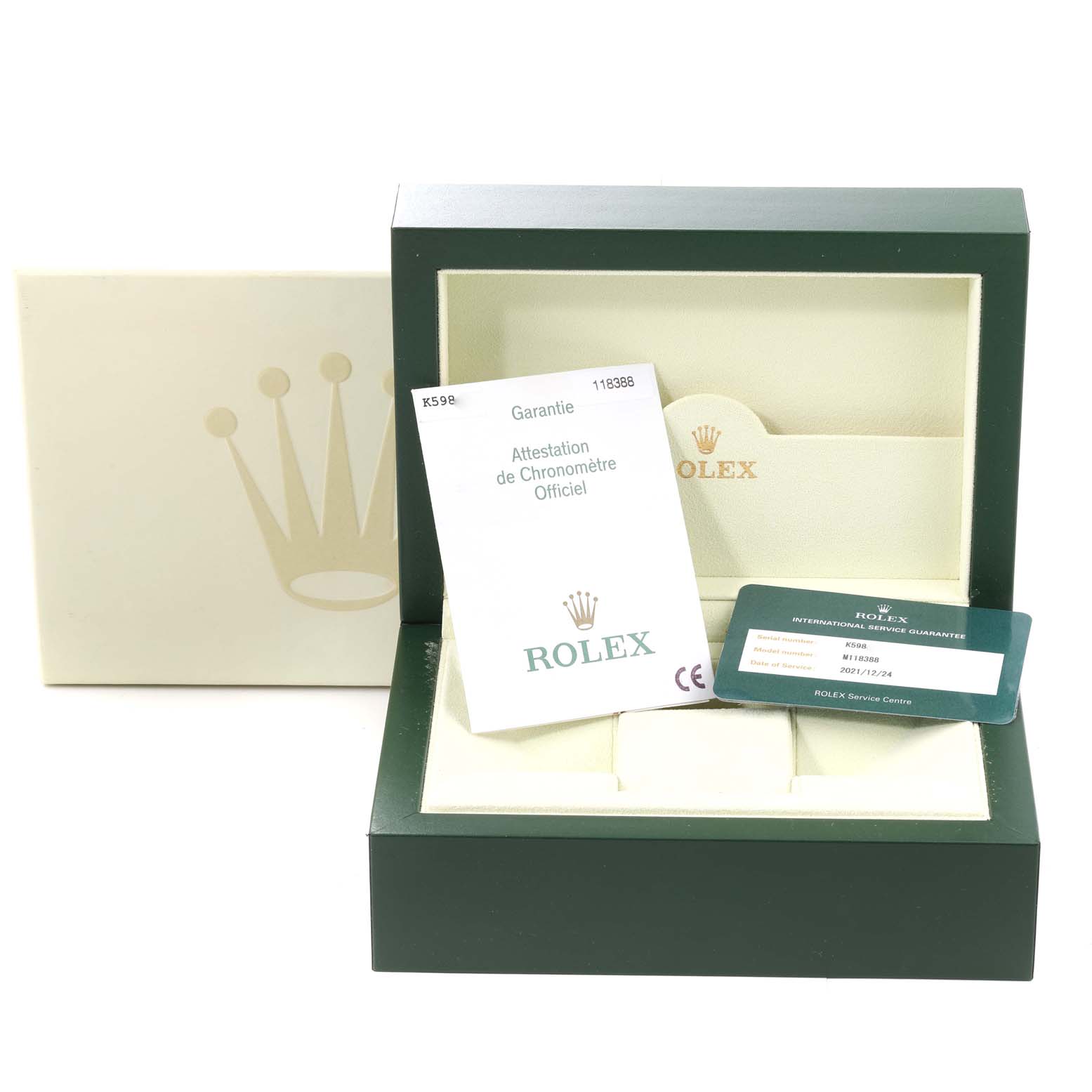 This Rolex President 118388 Men's Yellow Gold Champagne Dial 118388 Men's Yellow Gold Champagne Dial model packaging includes the watch box, paperwork, and warranty card displayed at an angle.