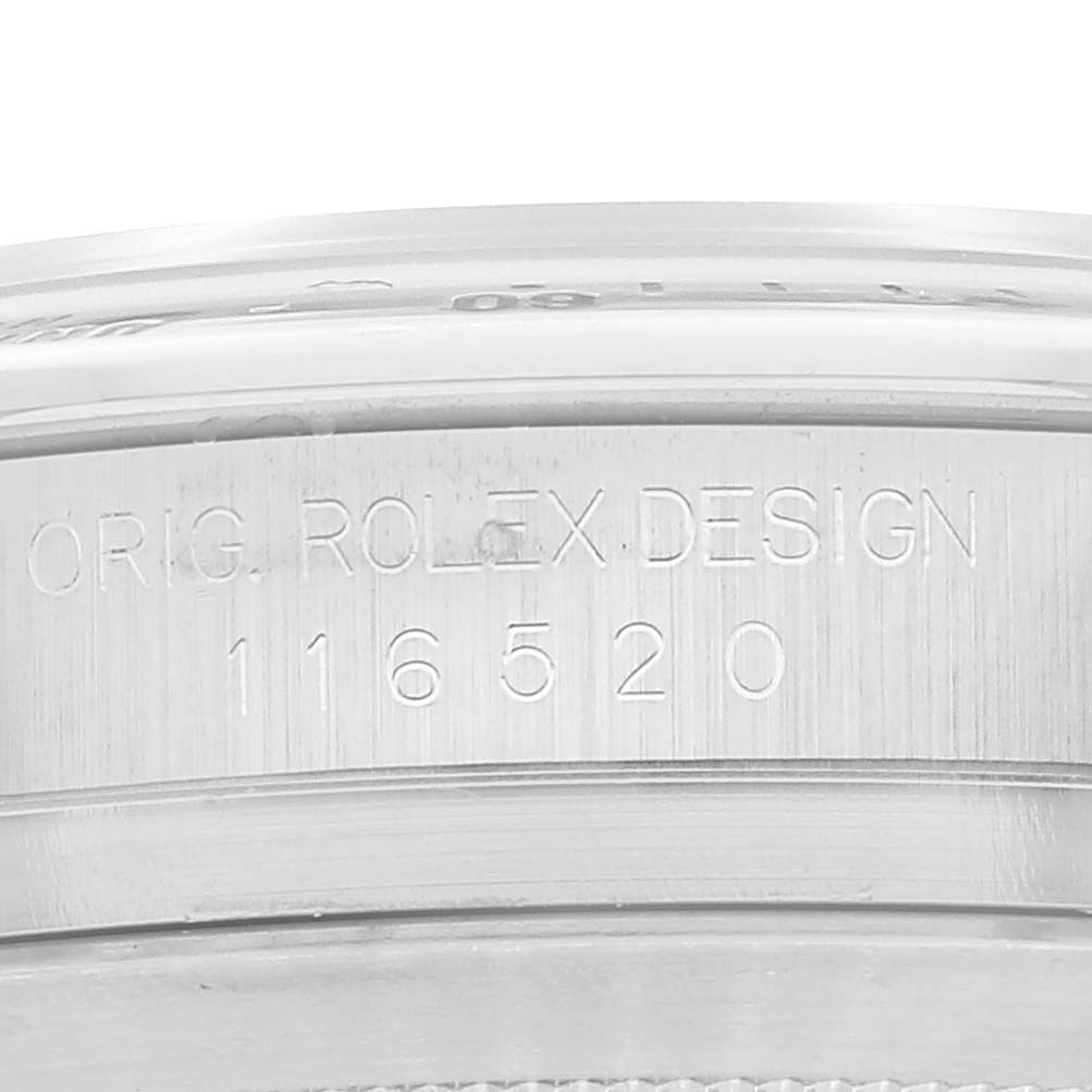 This image shows a close-up of the engravings on the case of a Rolex Daytona 116520 Men
s Stainless Steel White Dial 116520 Men
s Stainless Steel White Dial, model 116520.