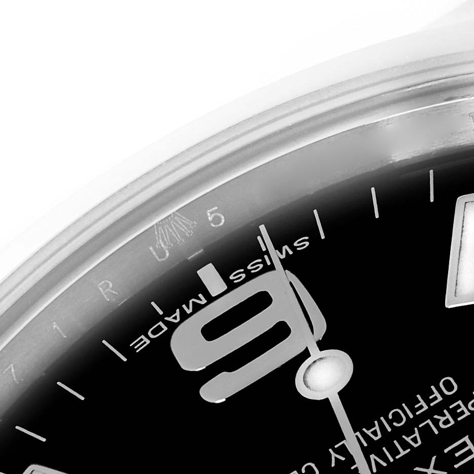 This is a close-up view of the dial and partially the bezel of a Rolex Explorer 214270 Men
s Stainless Steel Black Dial 214270 Men
s Stainless Steel Black Dial watch.