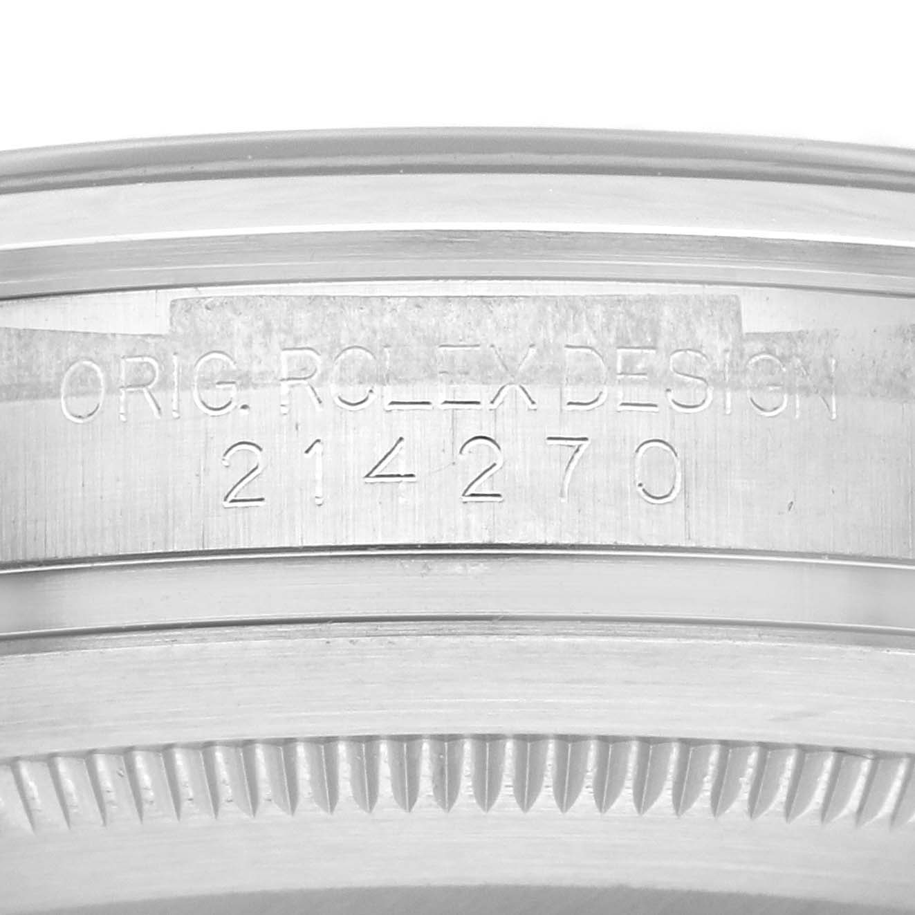 This image shows a close-up of the engraved serial number on the case of a Rolex Explorer 214270 Men
s Stainless Steel Black Dial 214270 Men
s Stainless Steel Black Dial model watch.