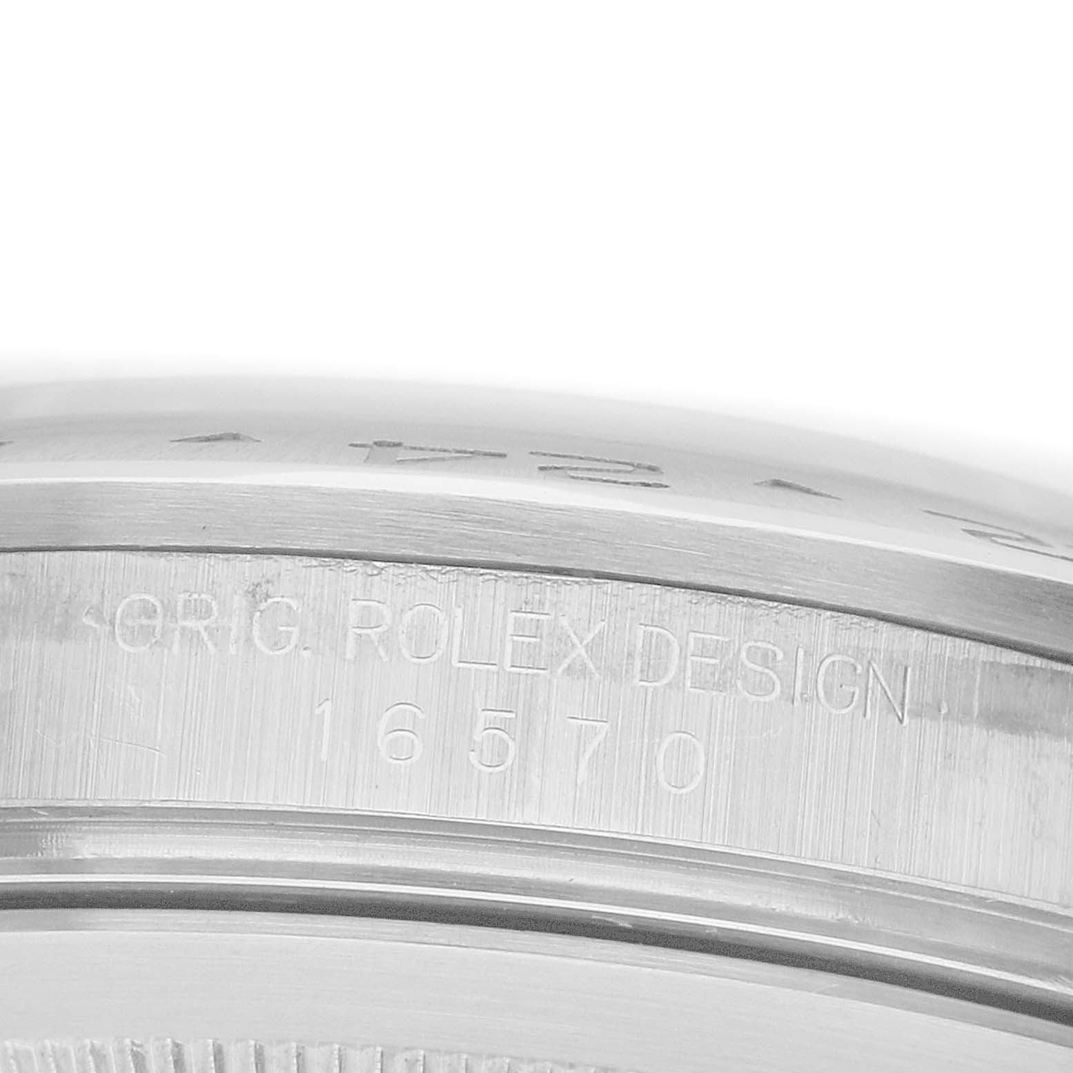 The image shows a close-up of the case side of a Rolex Explorer 16570 Men's Stainless Steel Black Dial, featuring engraved text with the model number 16570.