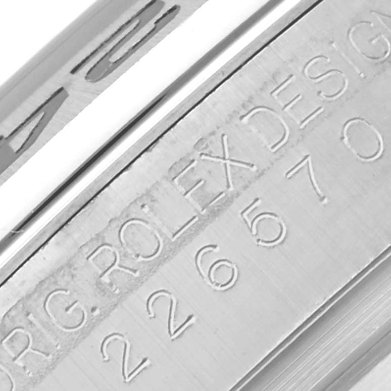 The image shows a close-up of the serial number engraving on the side of a Rolex Explorer 226570 Men's Stainless Steel White Dial 226570 Men's Stainless Steel White Dial watch case.