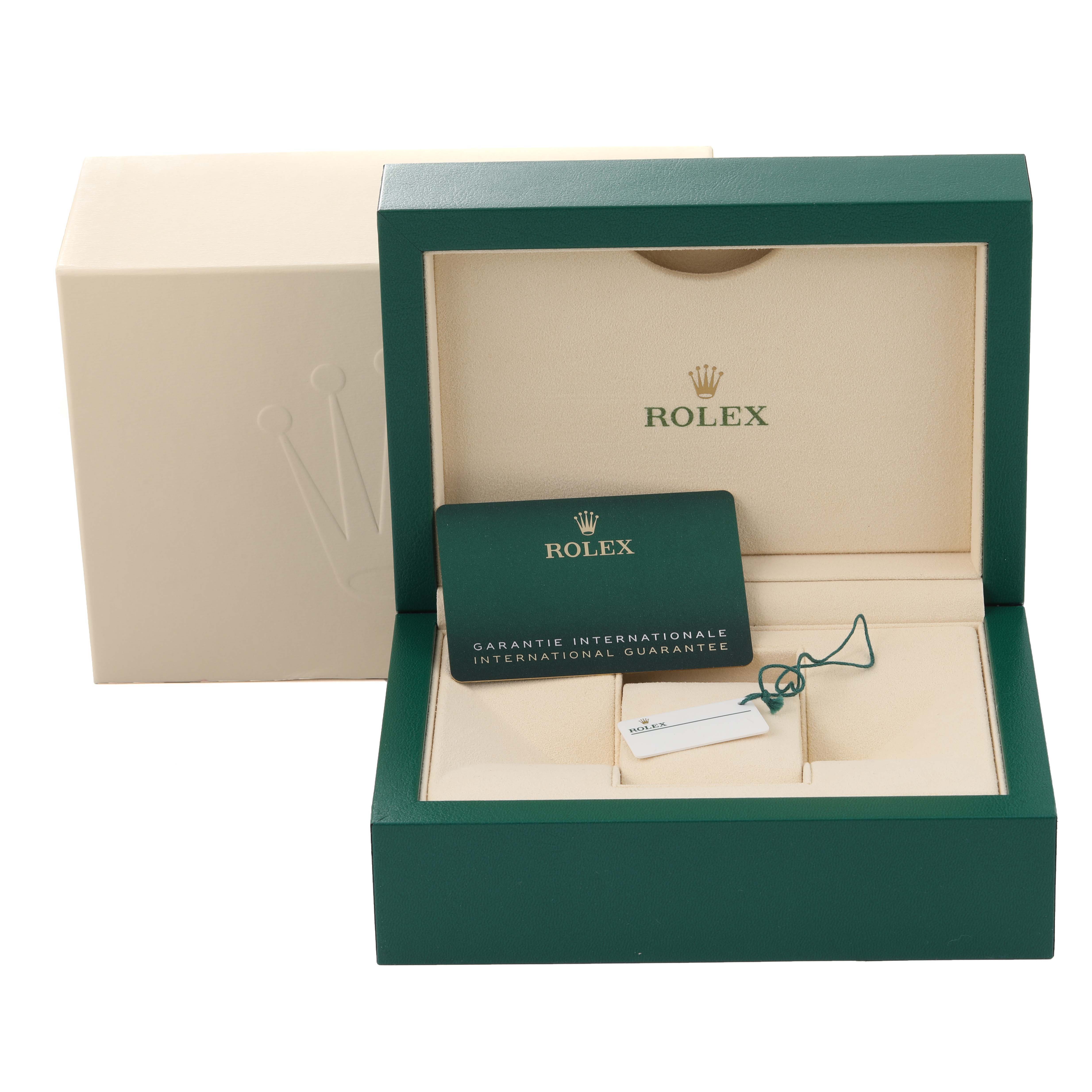 This image shows the packaging, warranty card, and tag for a Rolex Explorer 226570 Men's Stainless Steel White Dial 226570 Men's Stainless Steel White Dial model watch from a front angle.