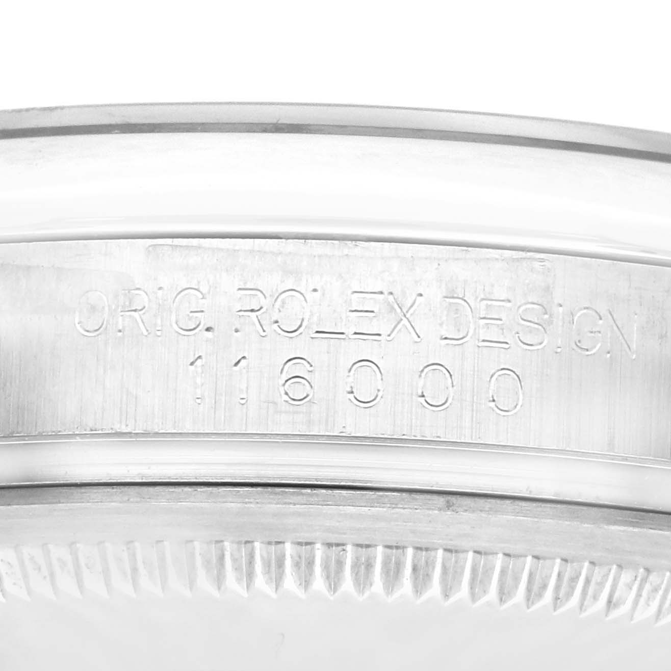 The image shows a close-up of the side of the case of the Rolex Oyster Perpetual 116000 Men
s Stainless Steel Black Dial 116000 Men
s Stainless Steel Black Dial, highlighting the engraved model number 116000.