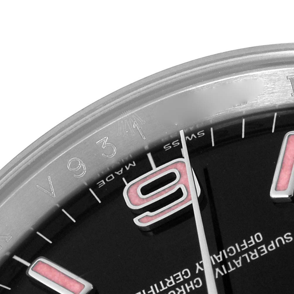 The close-up image shows part of the dial and bezel of a Rolex Oyster Perpetual 116000 Men
s Stainless Steel Black Dial 116000 Men
s Stainless Steel Black Dial watch, focusing on the 9 o
clock position.