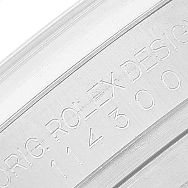 The image shows a close-up of the model number engraving on the casing of a Rolex Oyster Perpetual 114300 Men's Stainless Steel Grey Dial 114300 Men's Stainless Steel Grey Dial watch.