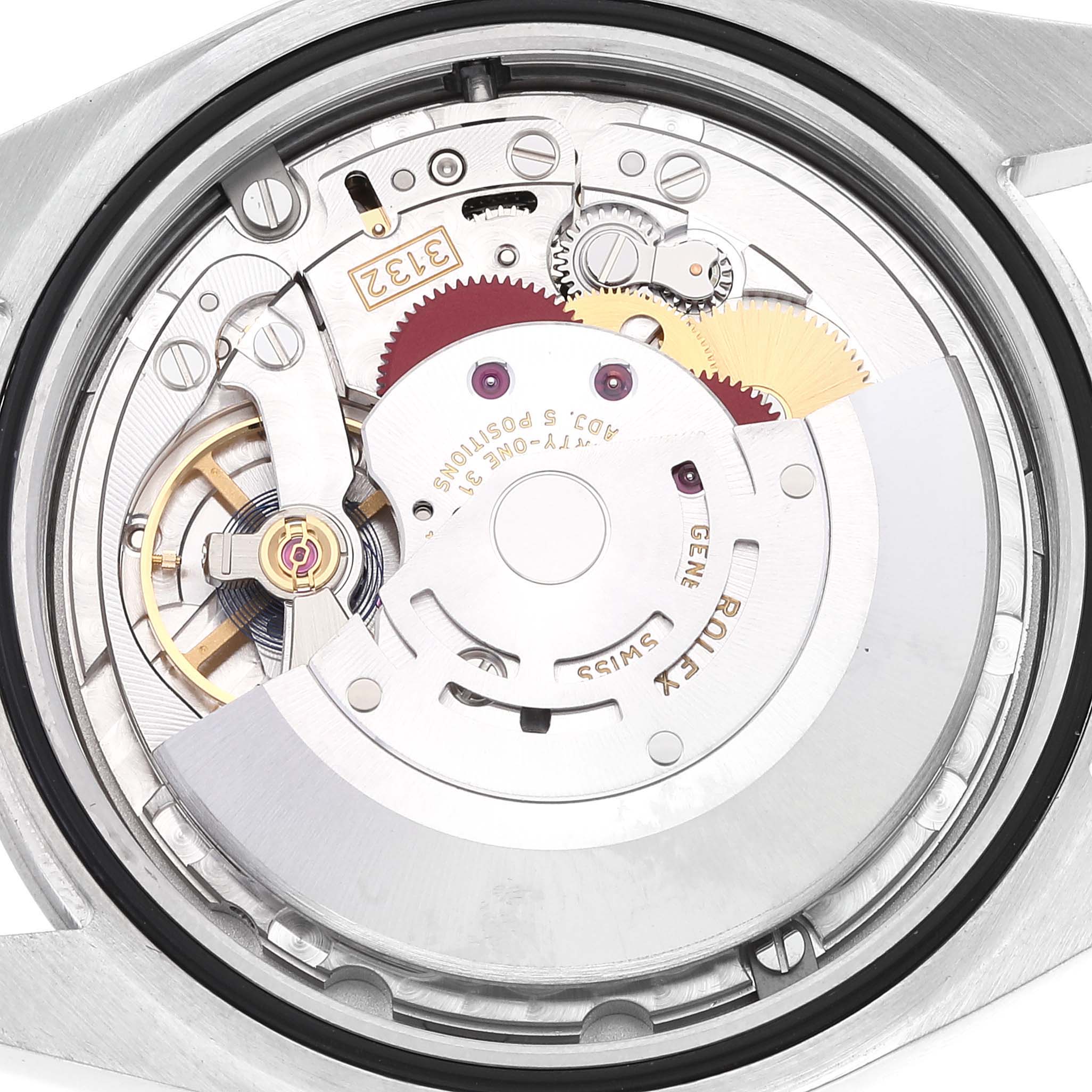 This image shows the inner mechanism of a Rolex Oyster Perpetual 114300 Men's Stainless Steel Blue Dial 114300 Men's Stainless Steel Blue Dial watch from a rear angle.