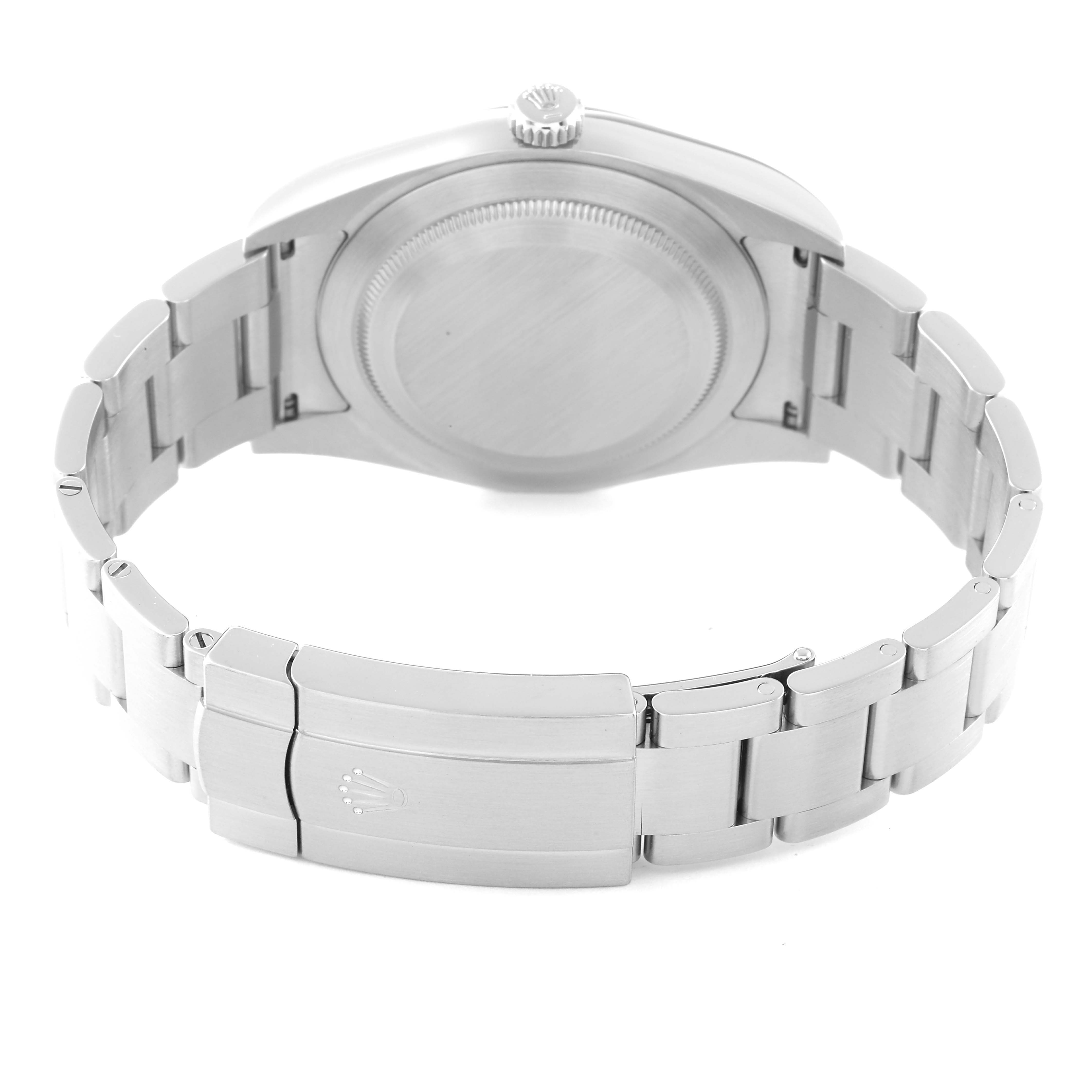 The image shows the backside and clasp of a Rolex Oyster Perpetual 114300 Men's Stainless Steel Blue Dial 114300 Men's Stainless Steel Blue Dial watch from a rear angle, highlighting the bracelet and the closed case back.