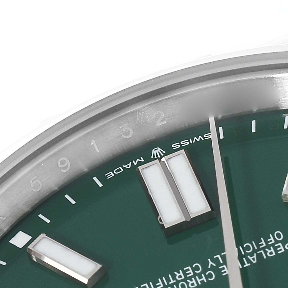 The image shows a close-up of the dial and markers of a Rolex Oyster Perpetual 124300 Men
s Stainless Steel Green Dial 124300 Men
s Stainless Steel Green Dial watch.