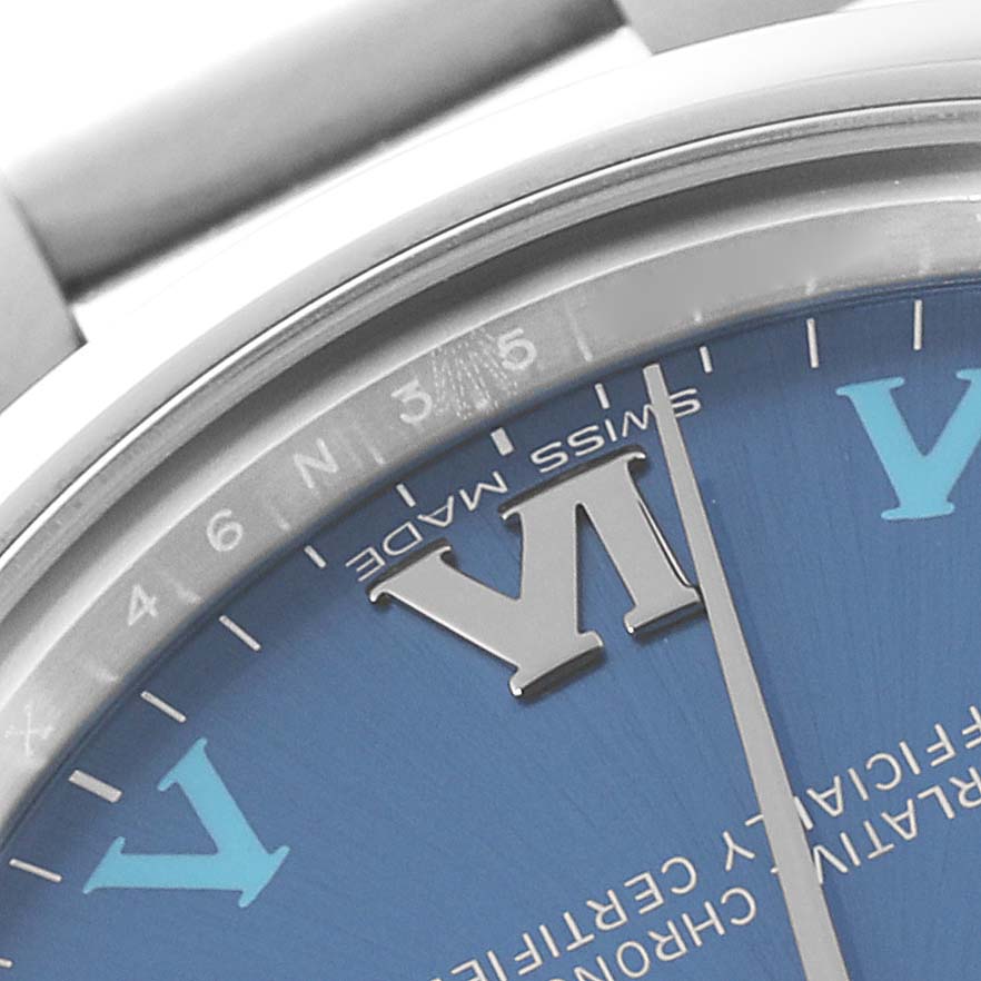 The image shows a close-up of a Rolex Mid-Size 177200 Women's Stainless Steel Blue Dial 177200 Women's Stainless Steel Blue Dial model, highlighting part of the dial, bezel, and bracelet link.