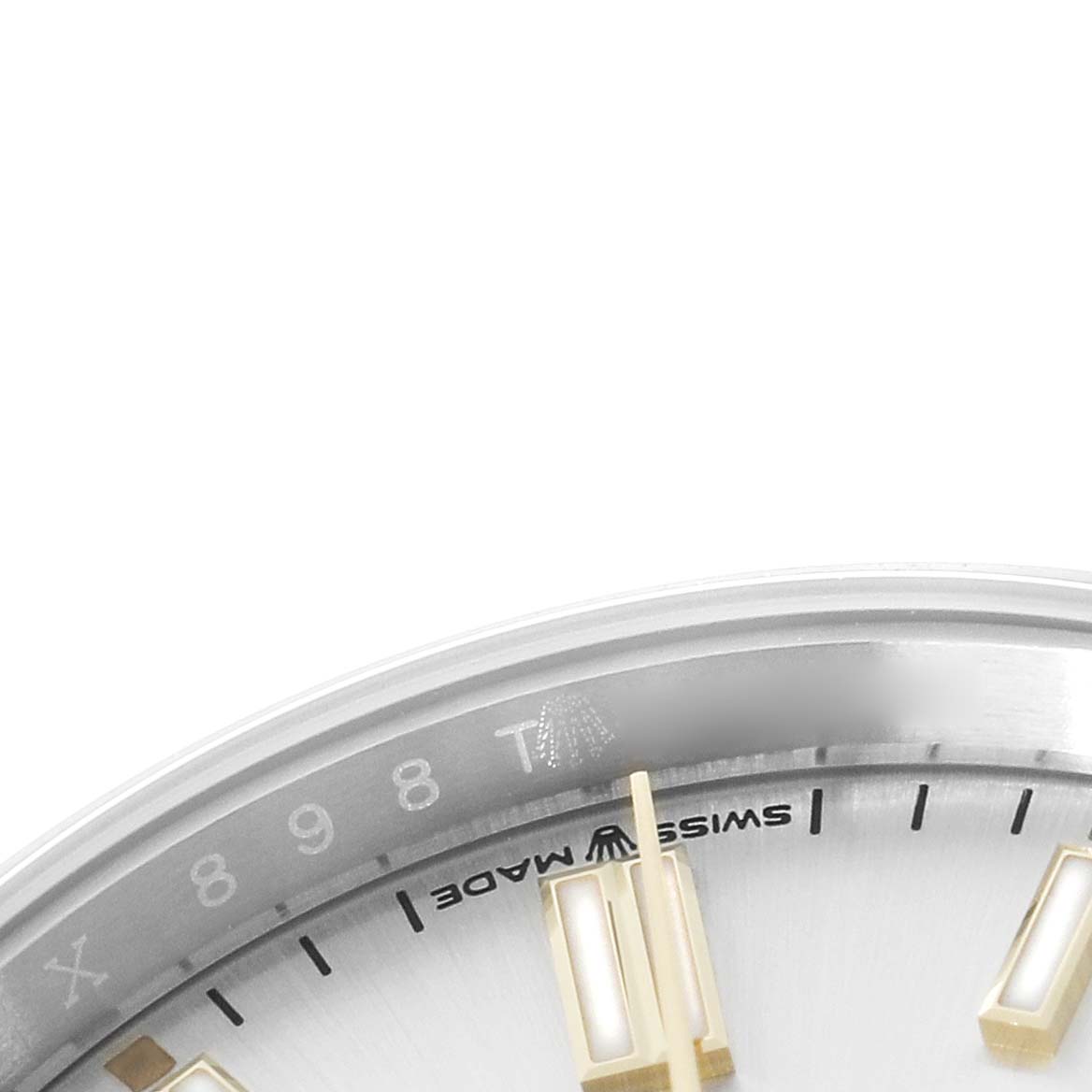 The image shows a partial close-up of the dial and outer edge of a Rolex Oyster Perpetual 126000 Men's Stainless Steel Silver Dial watch, highlighting hour markers and "Swiss Made."