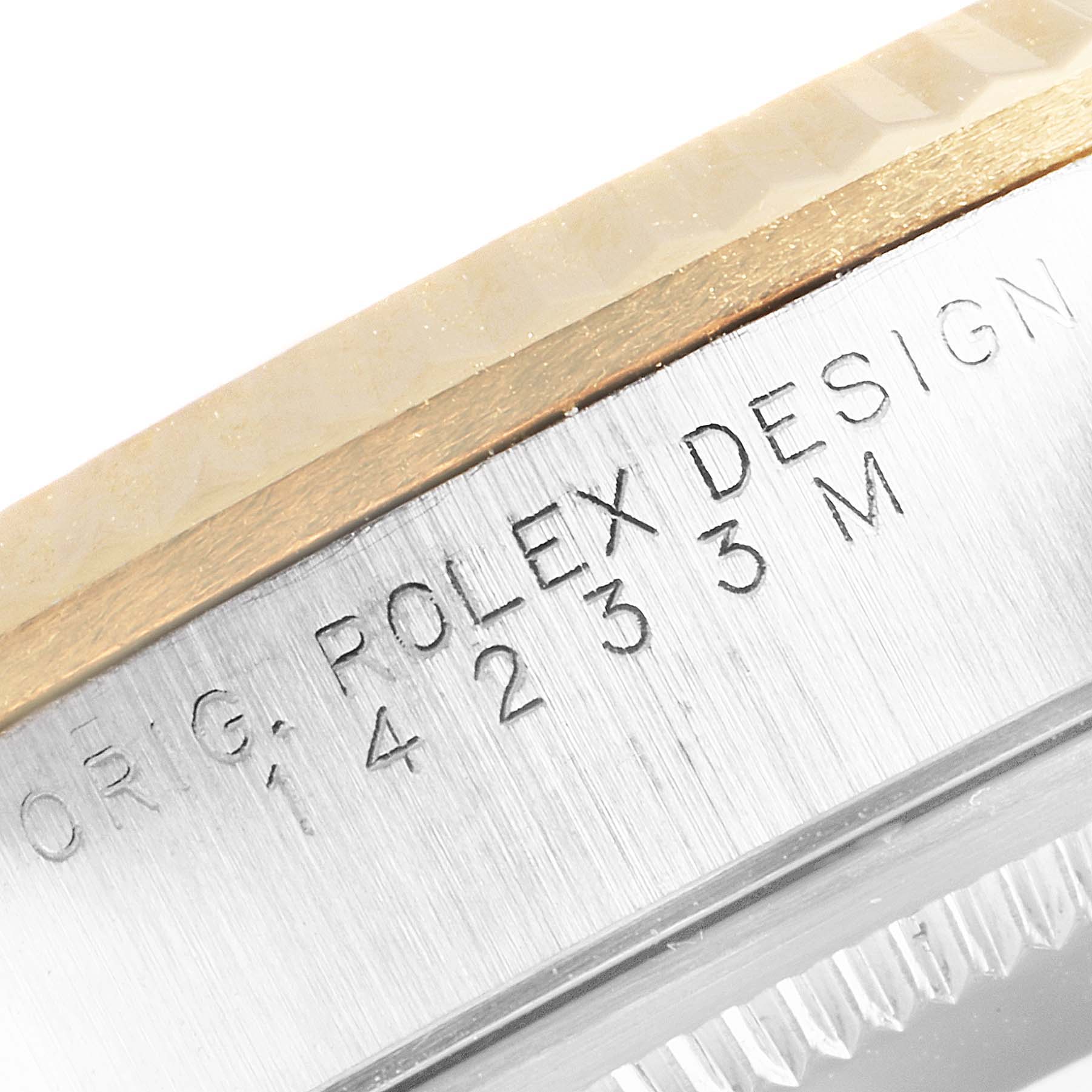 The image shows a close-up of the case side of a Rolex Oyster Perpetual 14233 Men's Steel and Gold (two tone) Grey Dial 14233 Men's Steel and Gold (two tone) Grey Dial watch, featuring the model number and "ROLEX DESIGN" engravings.