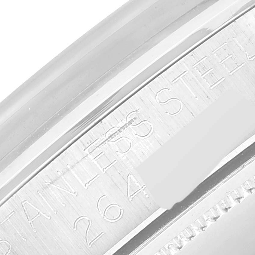 This close-up angle shows the engraved stainless steel area and partial serial number of the Rolex Oyster Perpetual 6426 Men's Stainless Steel Silver Dial 6426 Men's Stainless Steel Silver Dial watch.