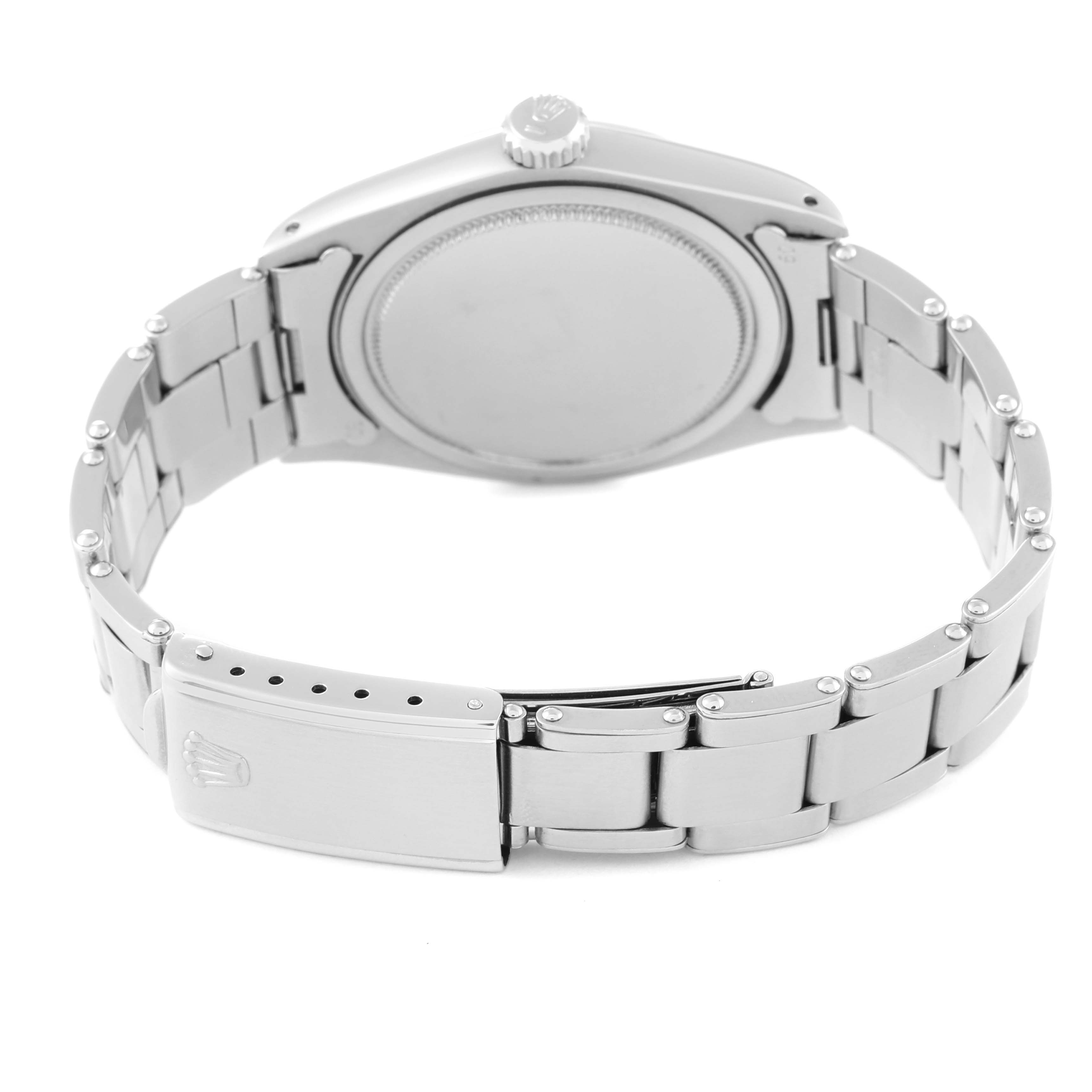 This image shows the back case and bracelet of a Rolex Oyster Perpetual 6426 Men's Stainless Steel Silver Dial 6426 Men's Stainless Steel Silver Dial watch from an angled rear view.