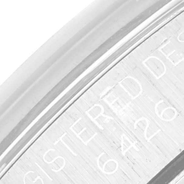This image shows a close-up of the engraved serial number on the side of the Rolex Oyster Perpetual 6426 Men's Stainless Steel Silver Dial 6426 Men's Stainless Steel Silver Dial watch case.