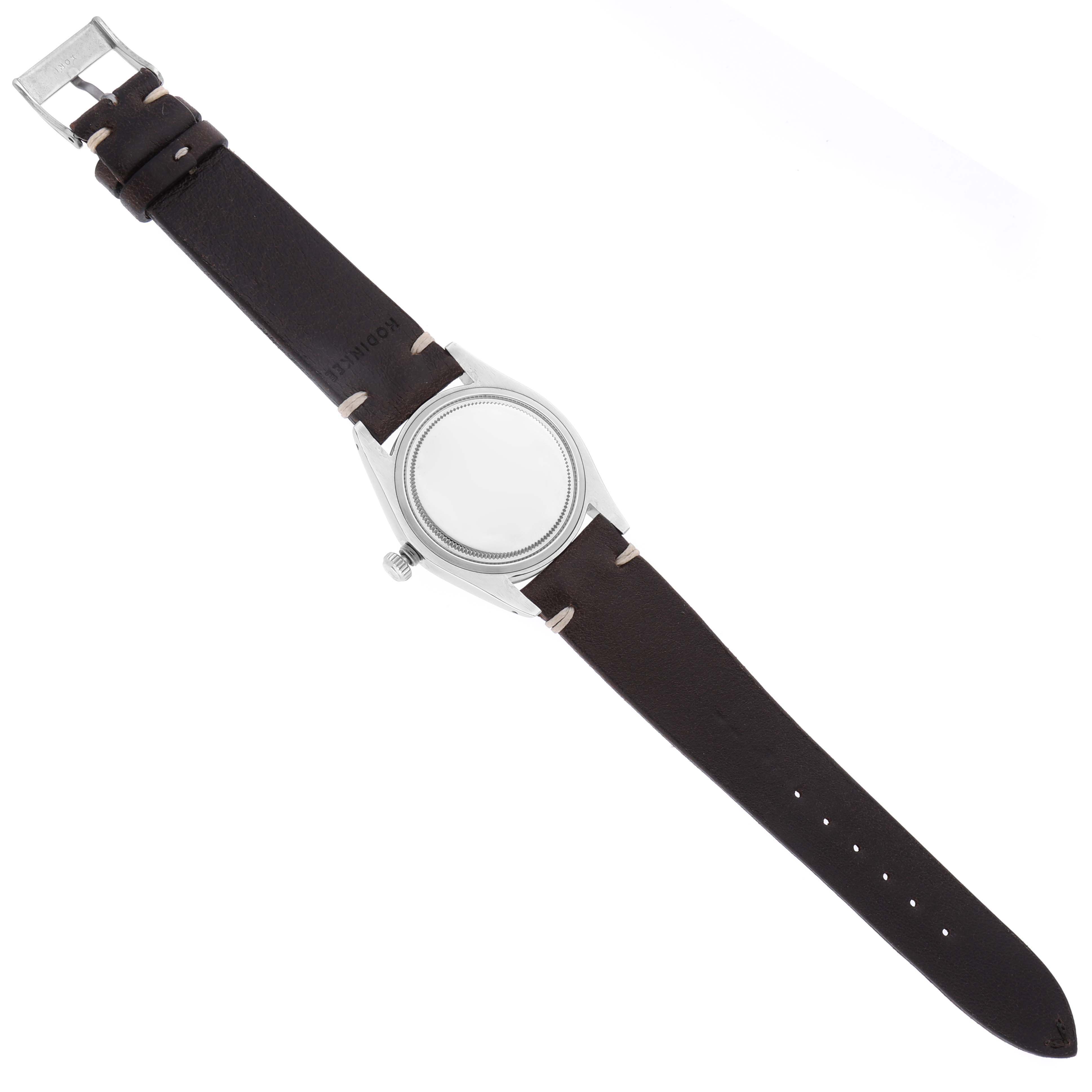 The image shows the front view of a Rolex Vintage Collection 6694 Men's Stainless Steel Blue Dial 6694 Men's Stainless Steel Blue Dial watch with a brown leather strap and a silver case.