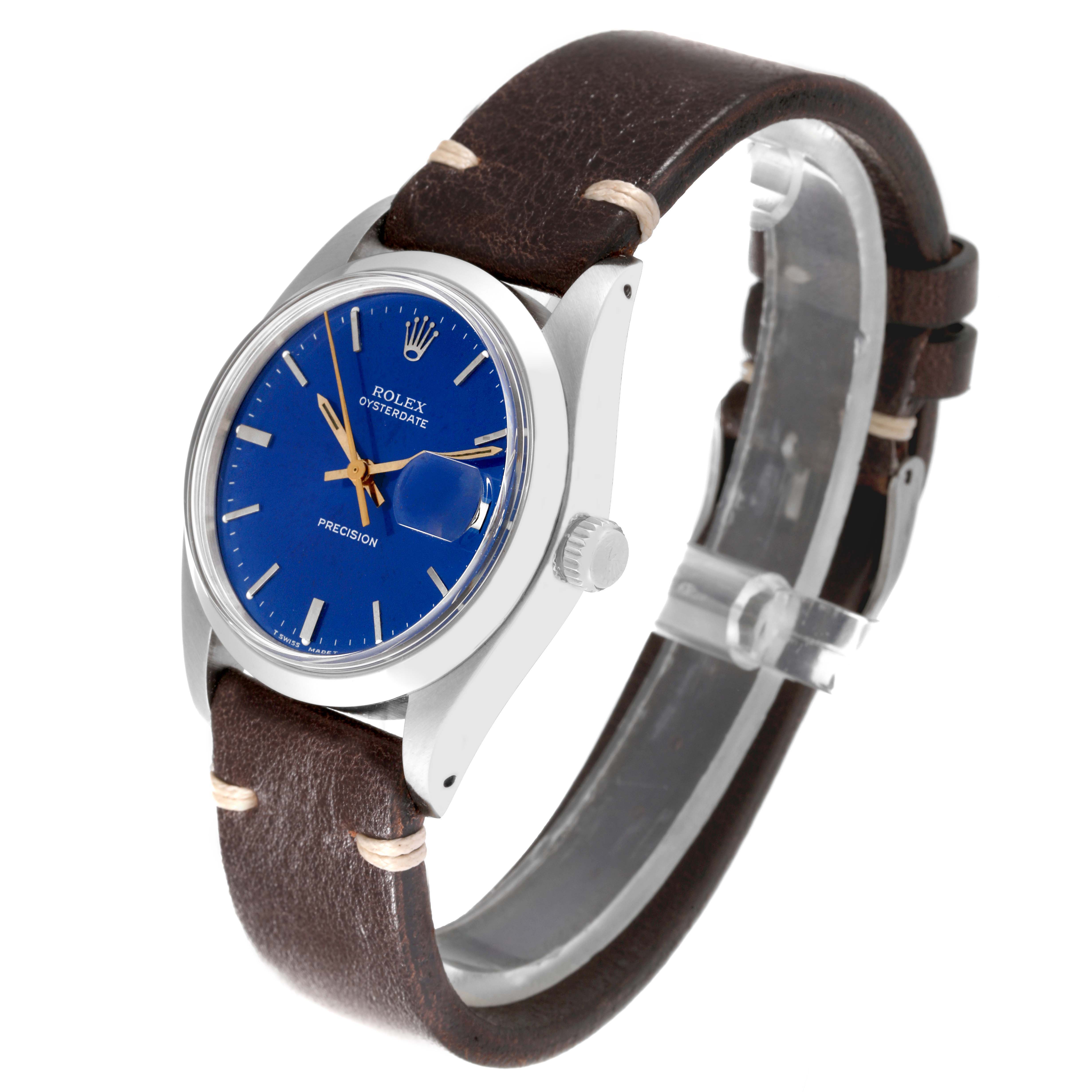 The Vintage Collection Rolex watch is shown at a three-quarter angle, featuring its blue dial, stainless steel case, and brown leather strap.