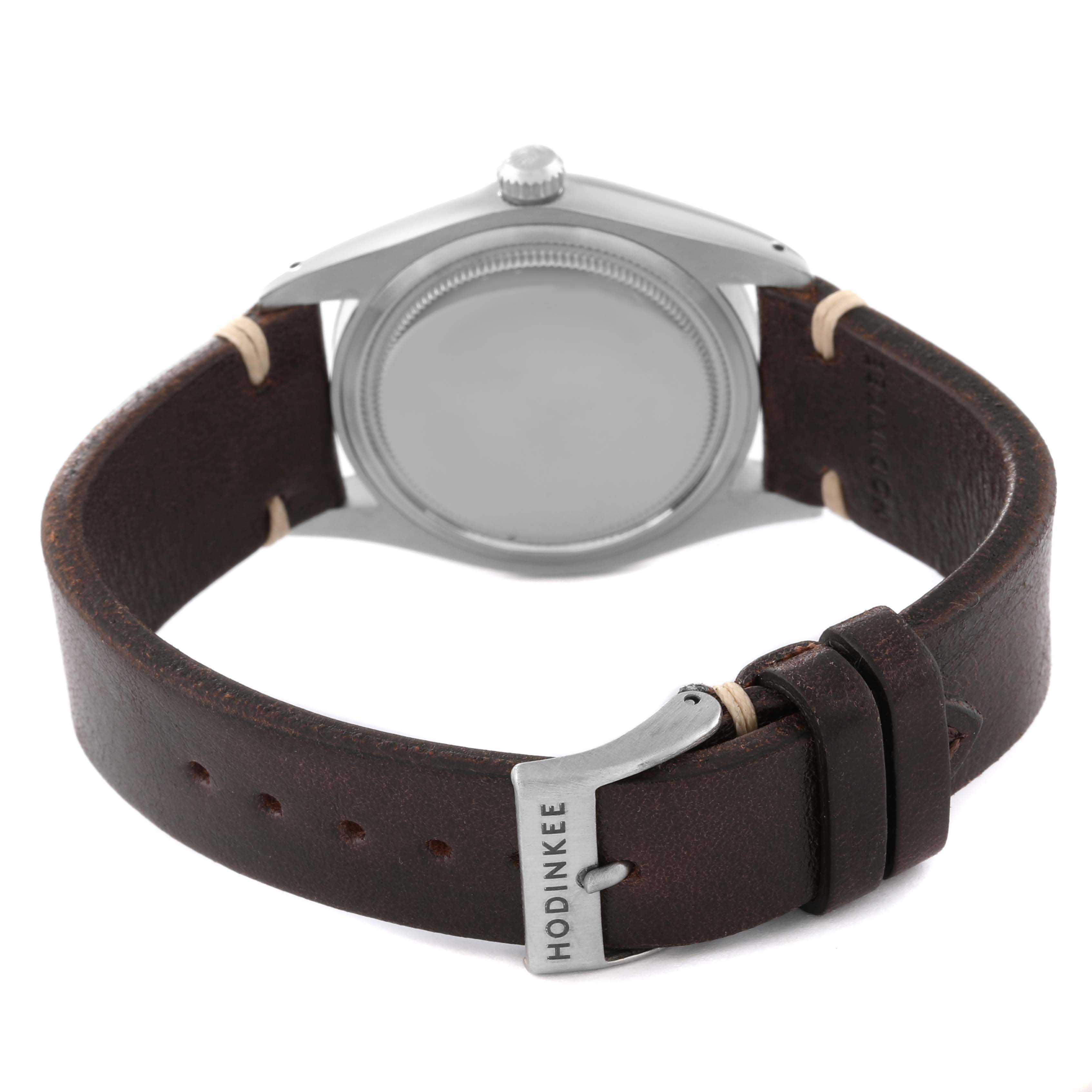 The image shows the back and side view of a Rolex Vintage Collection 6694 Men's Stainless Steel Blue Dial 6694 Men's Stainless Steel Blue Dial watch with a leather strap.