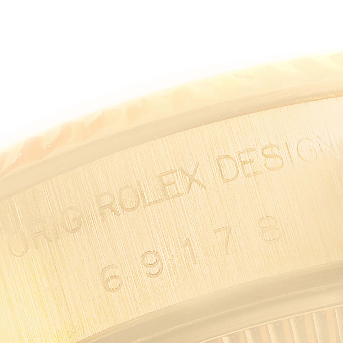 The image shows a close-up of the side view of the bezel and case with "Rolex" engraving on the President model by Rolex.