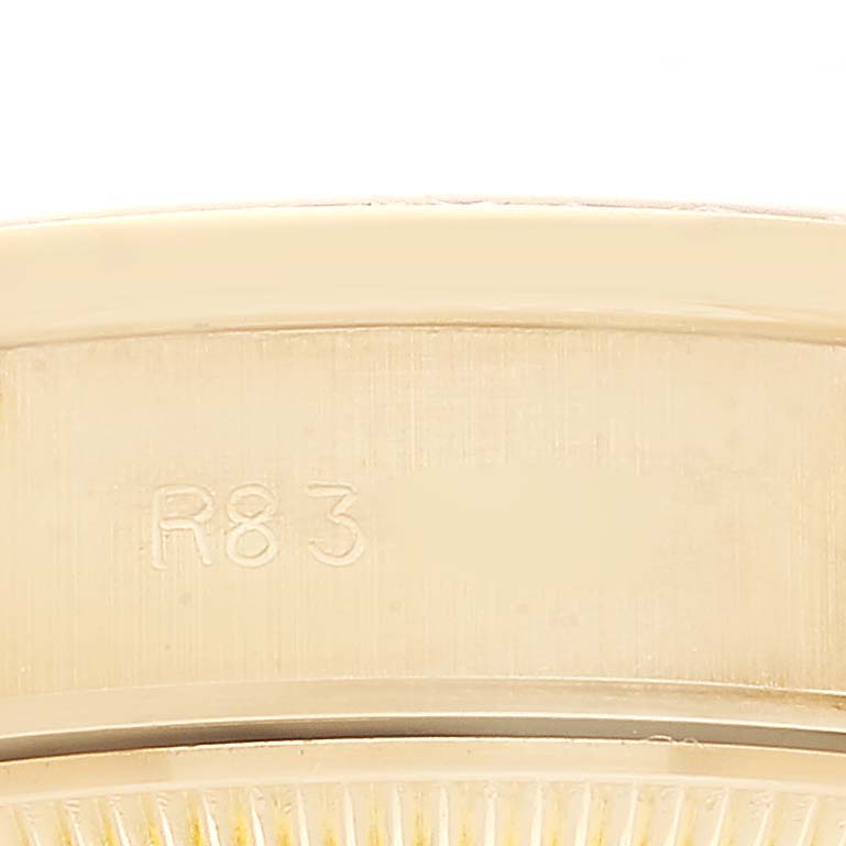 The image shows a close-up of the inner rim and inscription of a Rolex President 69138 Women's Yellow Gold Champagne Dial 69138 Women's Yellow Gold Champagne Dial model watch.