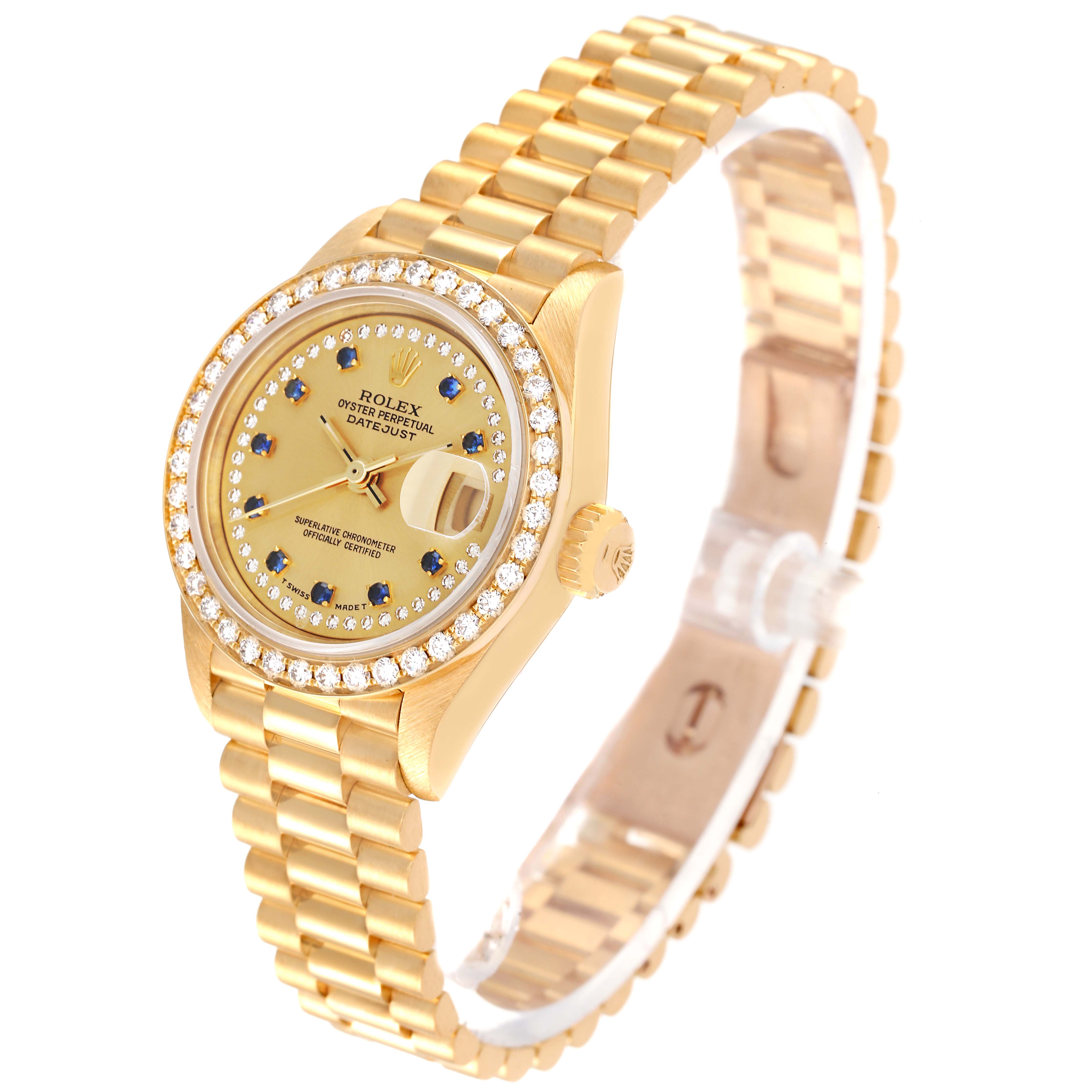 This image shows a Rolex President 69138 Women's Yellow Gold Champagne Dial 69138 Women's Yellow Gold Champagne Dial model watch at an angled view, highlighting the gold case, diamond bezel, dial, and bracelet.