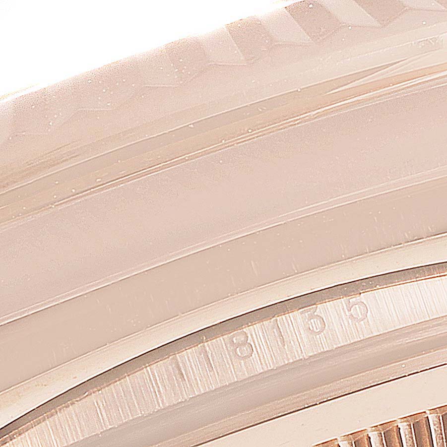 This image shows a close-up of the bezel and part of the dial for the Rolex President 118135 Men
s Rose Gold Brown Dial 118135 Men
s Rose Gold Brown Dial model watch.