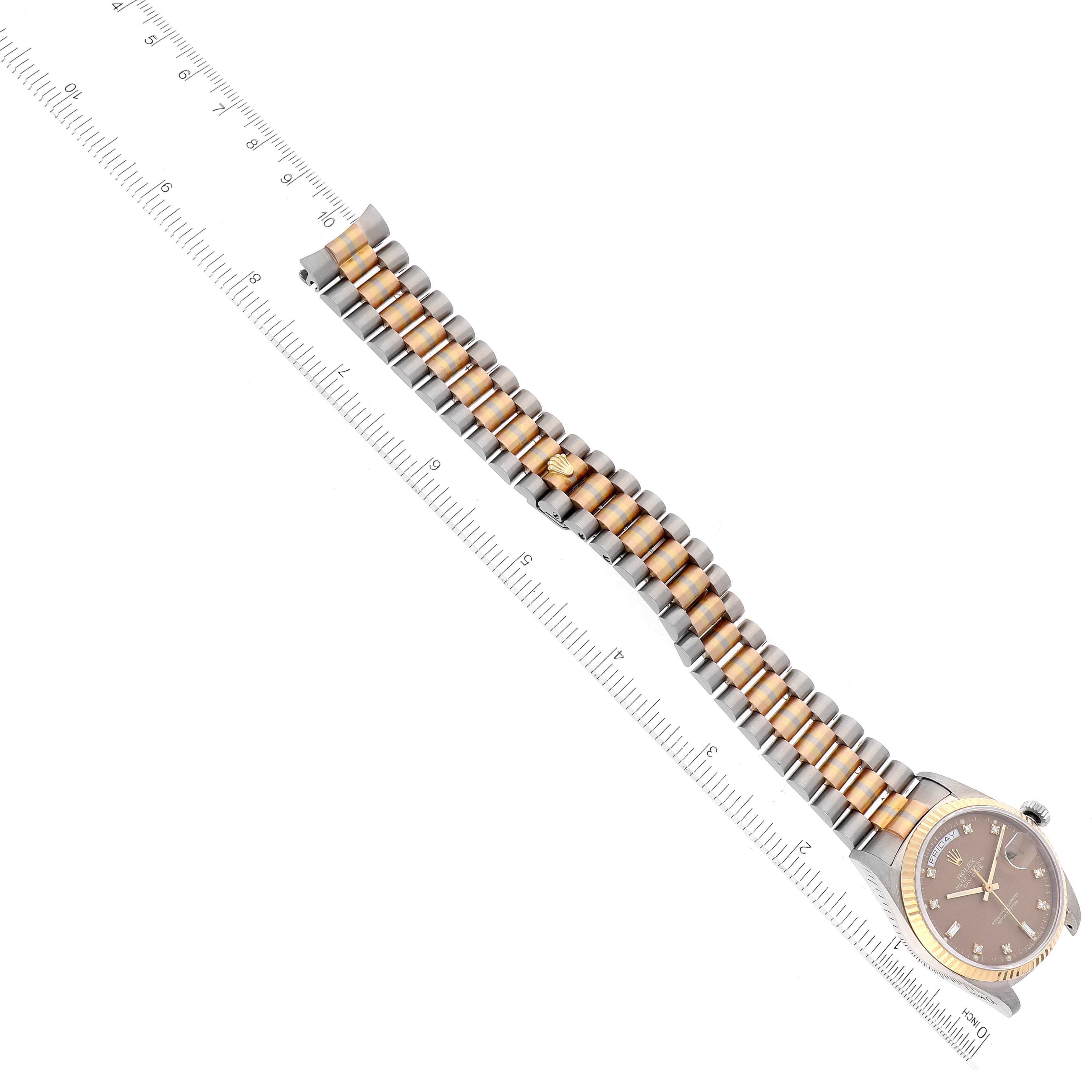 This image shows a Rolex President 18039B Men's White Gold Brown Dial 18039B Men's White Gold Brown Dial model watch laid flat with its band extended alongside a ruler for measurement.