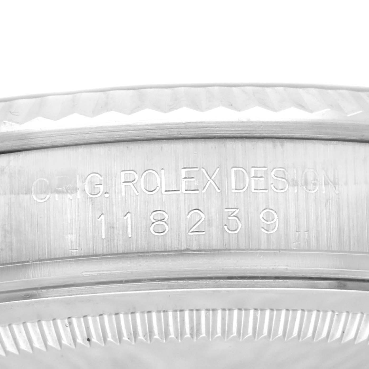 This image shows the engraved side detail of a Rolex President 118239 Men's White Gold Silver Dial 118239 Men's White Gold Silver Dial model, highlighting the serial number and Rolex design engraving.