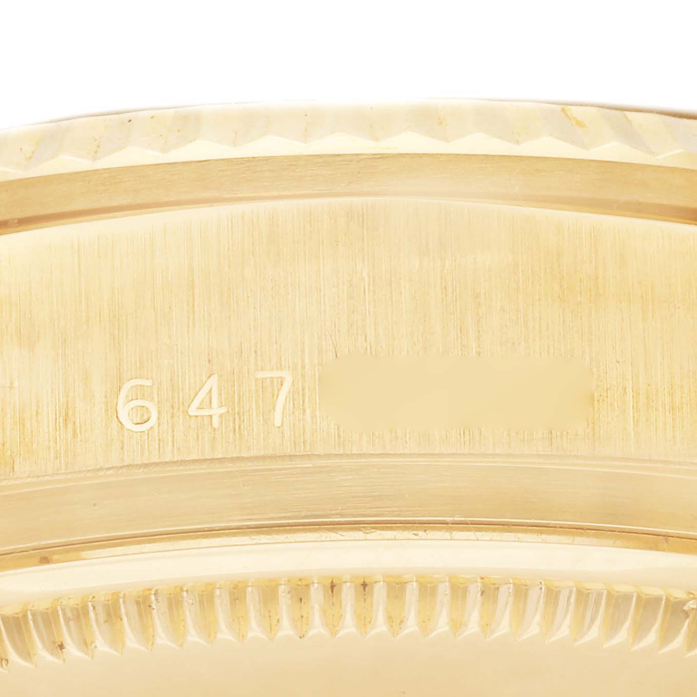 The image shows a close-up of the Rolex President 18038 Men
s Yellow Gold Champagne Dial 18038 Men
s Yellow Gold Champagne Dial model watch’s case with the reference number partially visible.