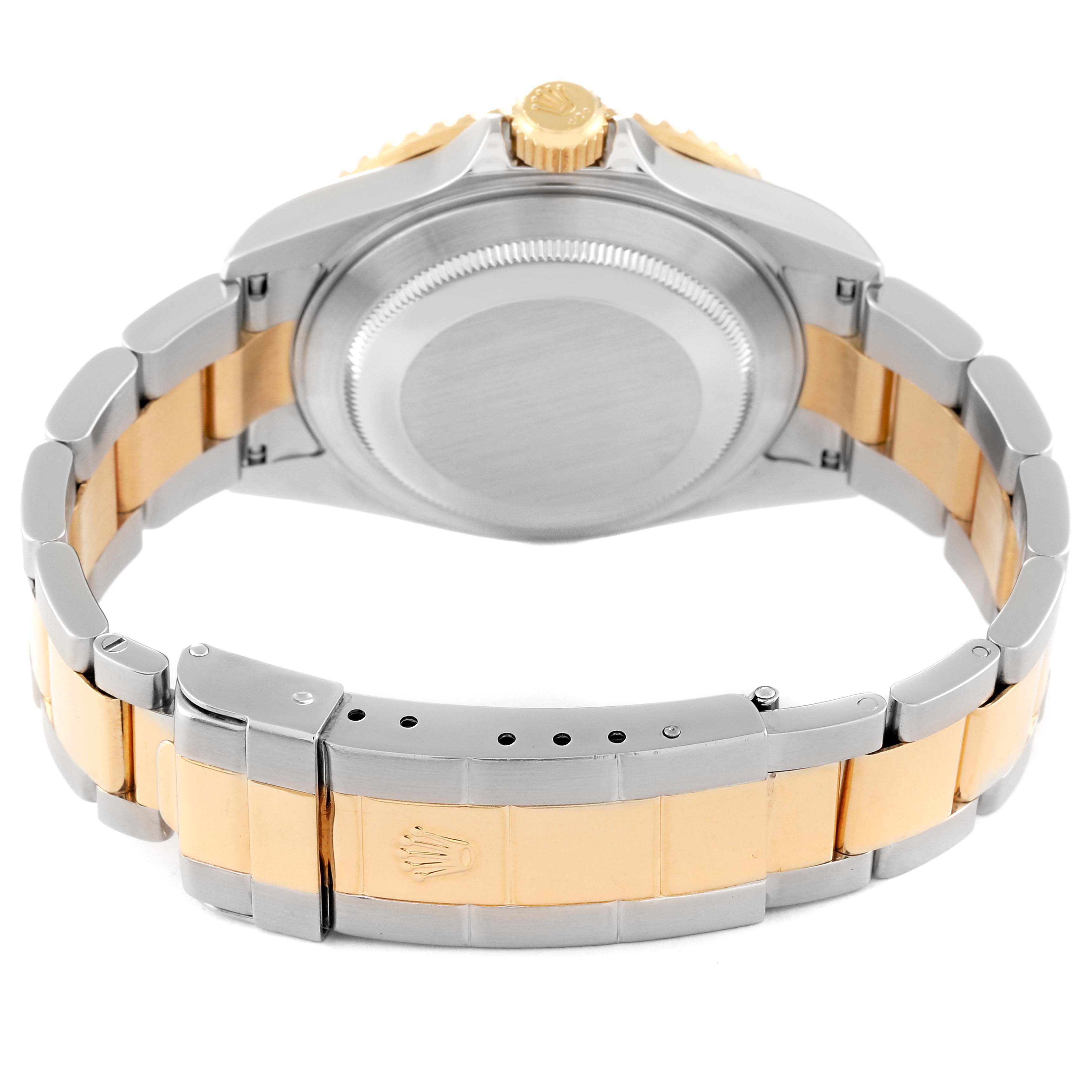 The image shows the back side of a Rolex Submariner 16613 Men's Steel and Gold (two tone) Blue Dial 16613 Men's Steel and Gold (two tone) Blue Dial watch, highlighting its bracelet and case back.