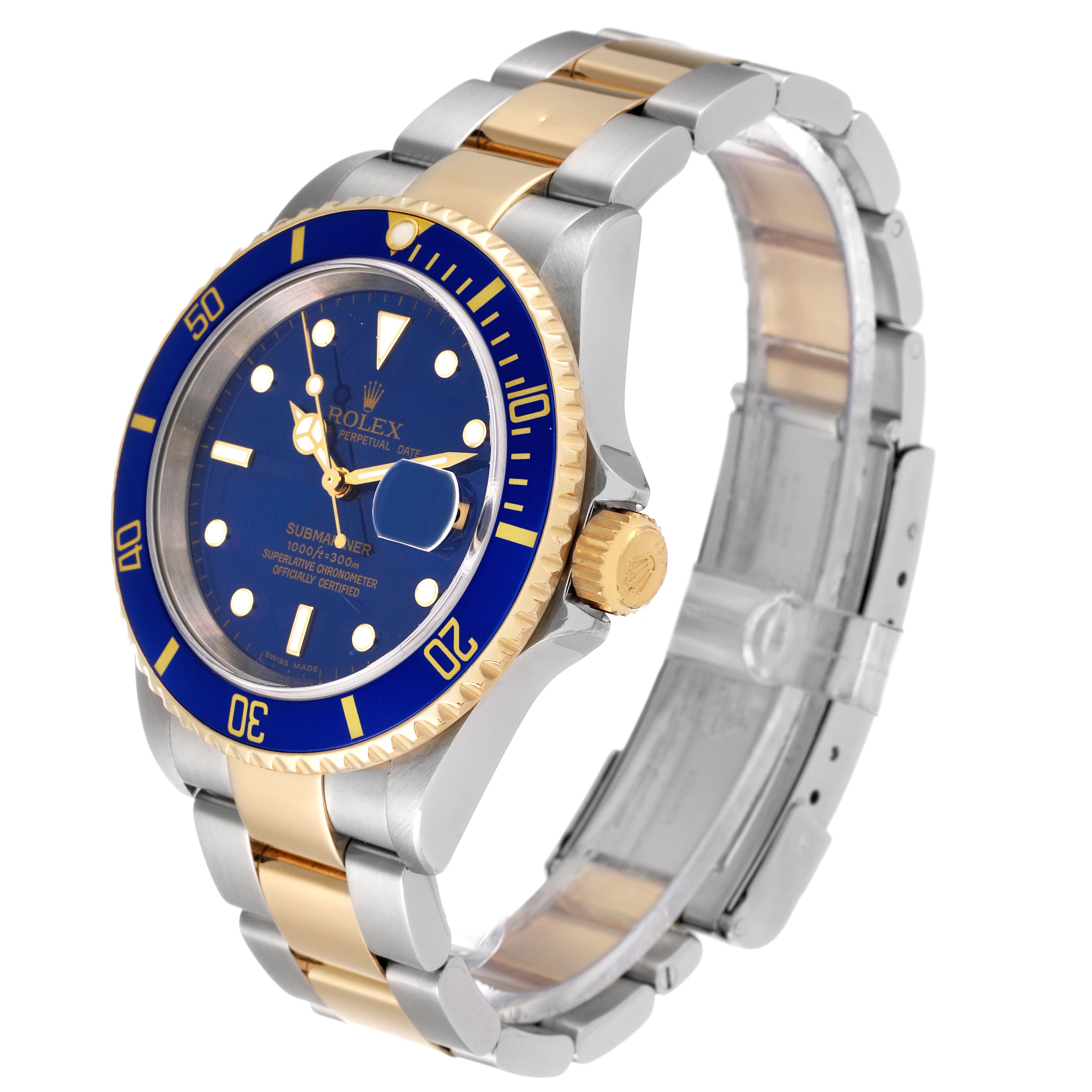 This image shows a Rolex Submariner 16613 Men's Steel and Gold (two tone) Blue Dial 16613 Men's Steel and Gold (two tone) Blue Dial watch at a slight angle, highlighting the face, bezel, crown, and two-tone metal bracelet.