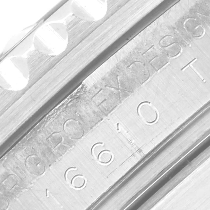 This close-up image shows the engraved side of the bezel and case of a Rolex Submariner 16610 Men's Stainless Steel Black Dial 16610 Men's Stainless Steel Black Dial watch.