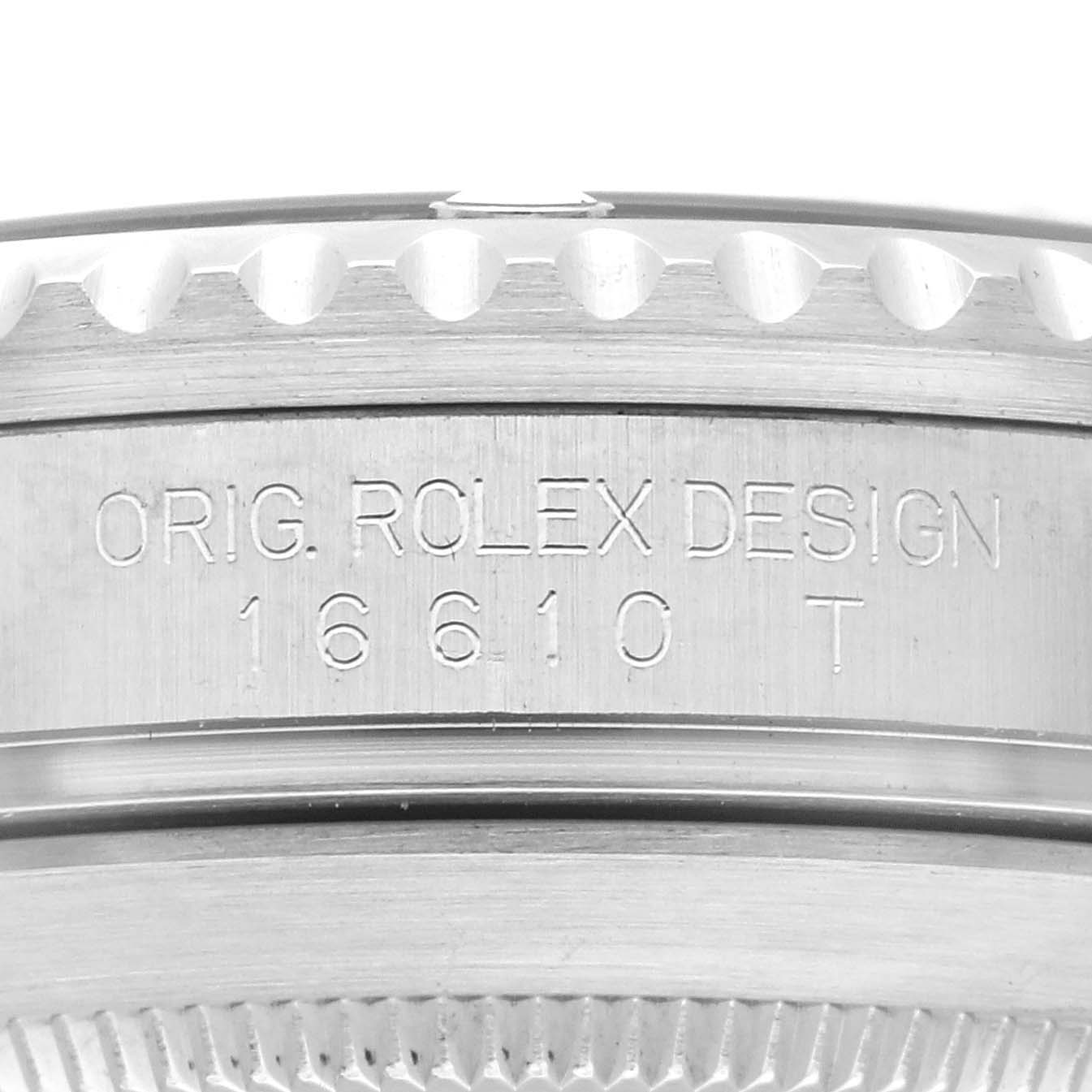 The image shows a close-up of the side of the Rolex Submariner 16610 Men
s Stainless Steel Black Dial 16610 Men
s Stainless Steel Black Dial watch case, highlighting the engraved model number "16610 T".