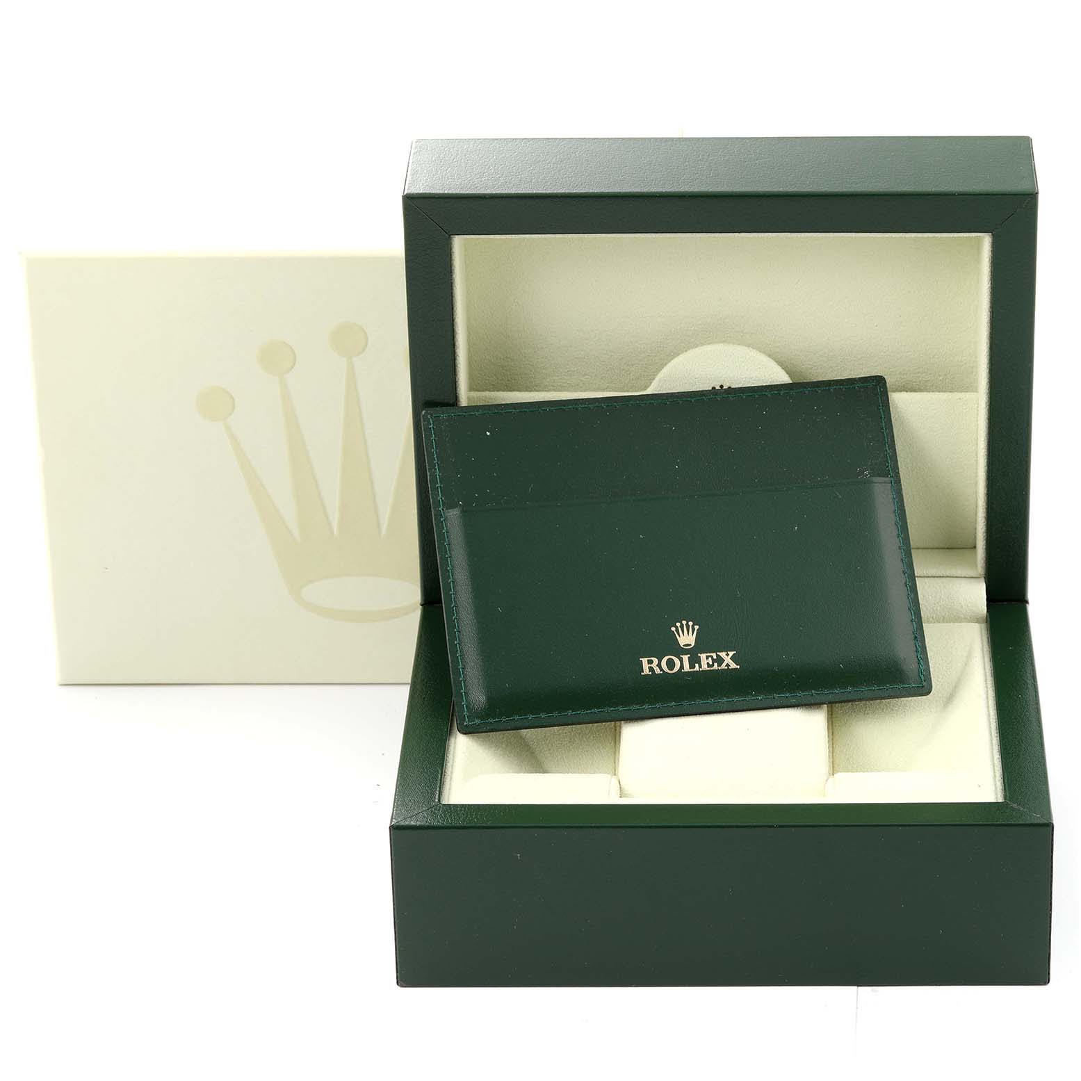 The image shows a Rolex Submariner 16610 Men
s Stainless Steel Black Dial 16610 Men
s Stainless Steel Black Dial watch box and accessories, including a green cardholder, viewed from the front.