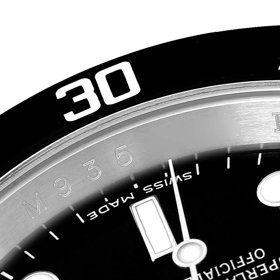 This close-up image of a Rolex Submariner 16610 Men
s Stainless Steel Black Dial 16610 Men
s Stainless Steel Black Dial watch shows part of the bezel and dial with "30" and "Swiss Made" marking.