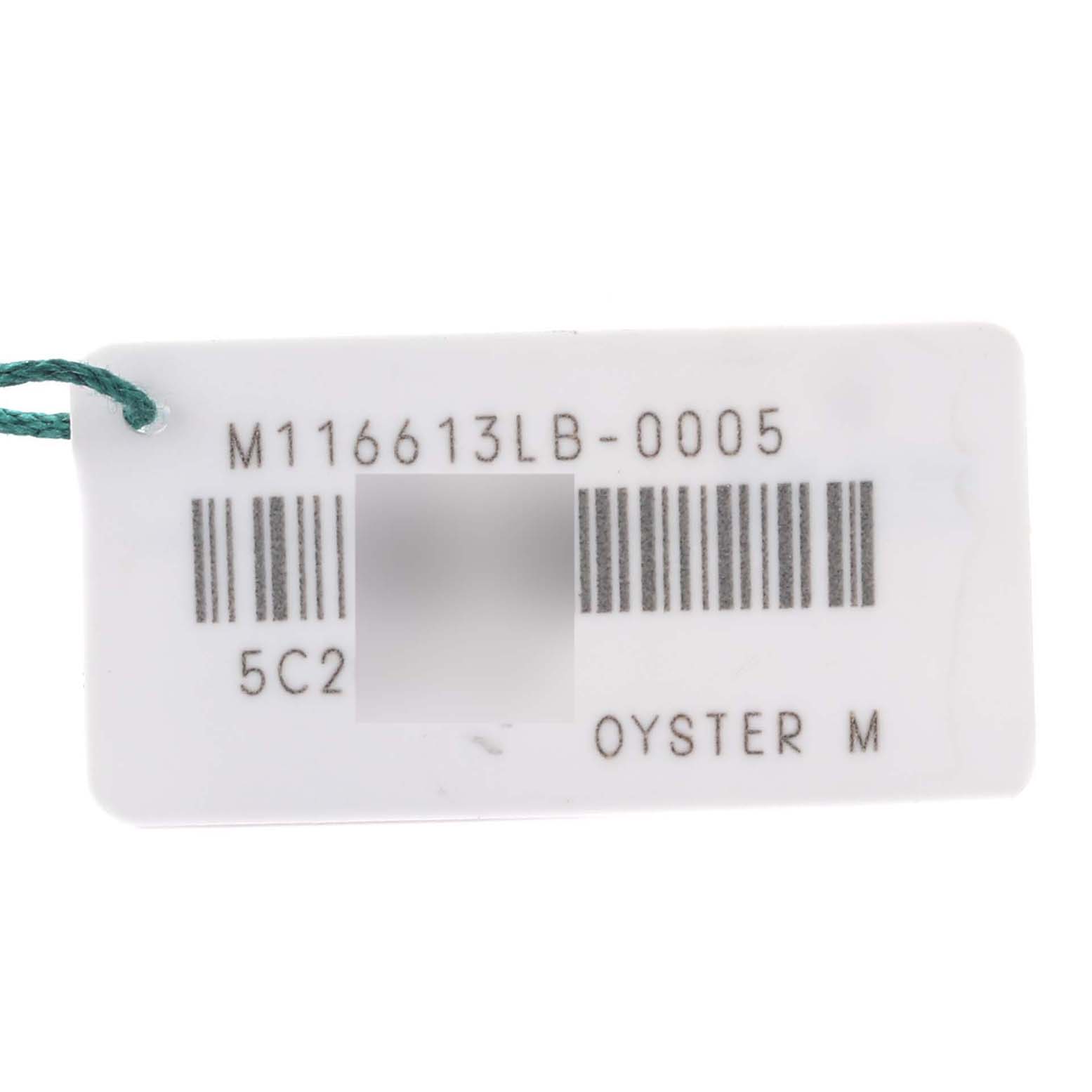 This image shows a close-up of a tag for a Rolex Submariner 64733 Men's Steel and Gold (two tone) Blue Dial 64733 Men's Steel and Gold (two tone) Blue Dial model, displaying the model number and Oyster M details.