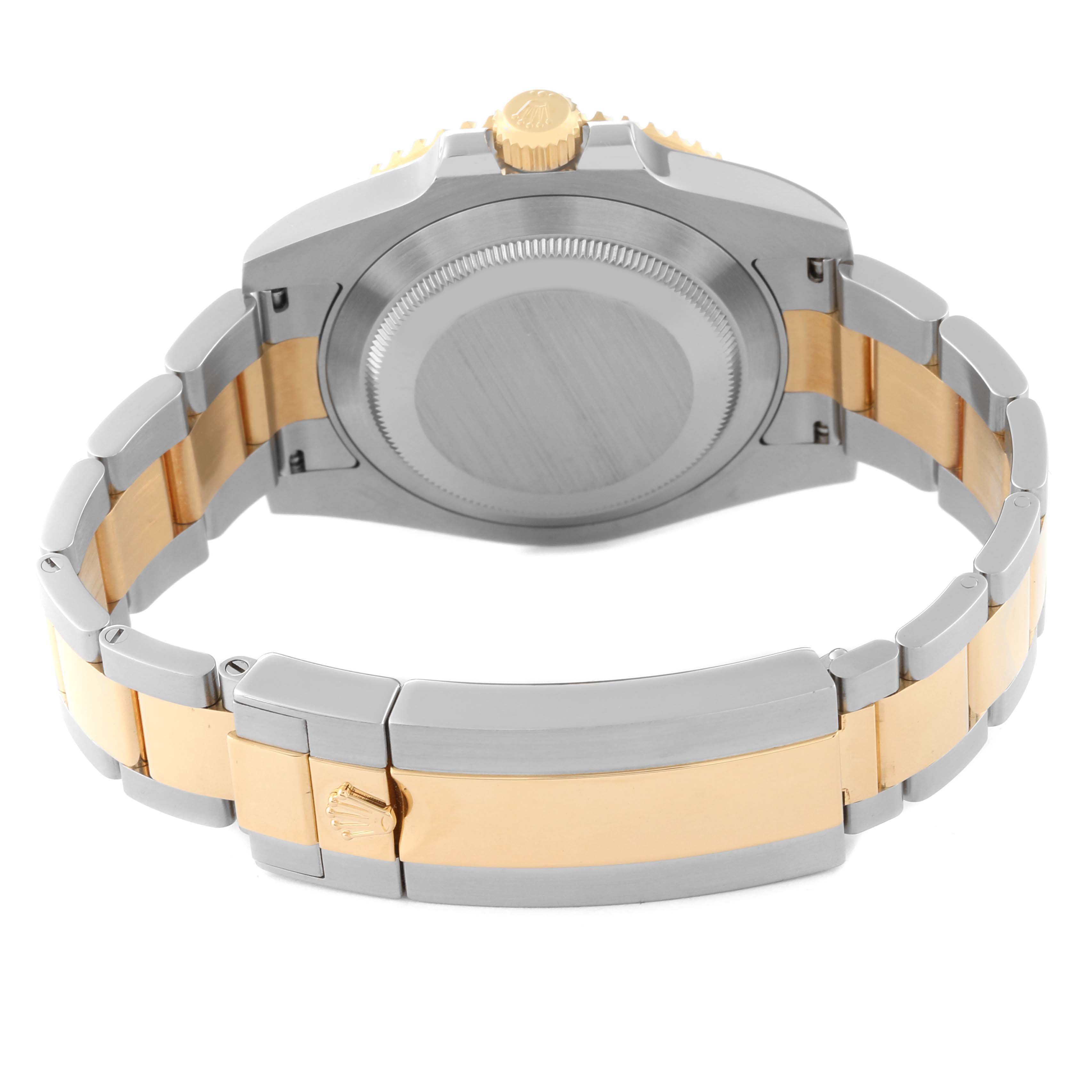 The image shows the back case and bracelet of the Rolex Submariner 64733 Men's Steel and Gold (two tone) Blue Dial 64733 Men's Steel and Gold (two tone) Blue Dial watch at an angle focused on the clasp and back-cover.