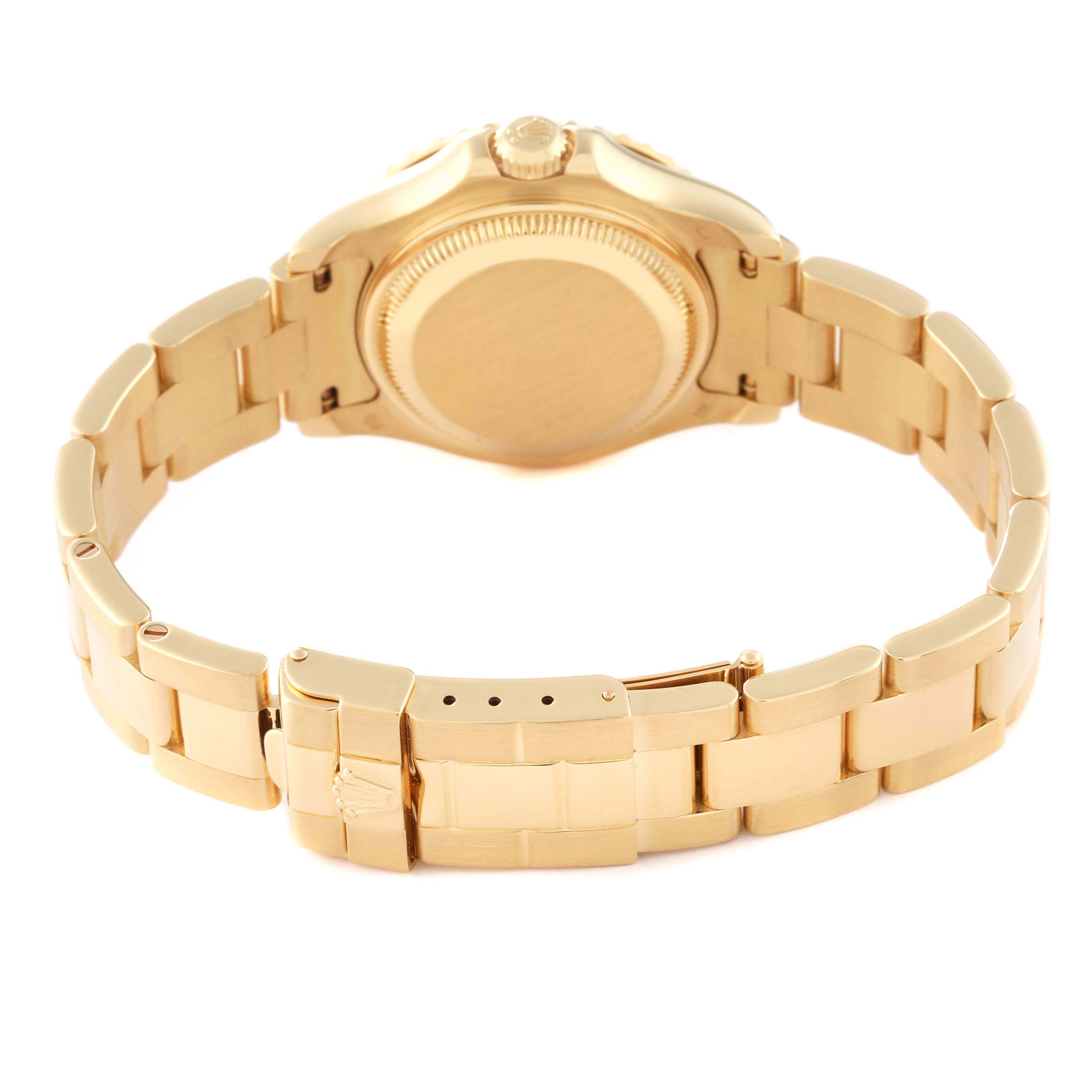 The image shows the back, clasp, and part of the bracelet of a Rolex Yacht-Master 69628 Women's Yellow Gold Blue Dial 69628 Women's Yellow Gold Blue Dial watch at an angled rear view.