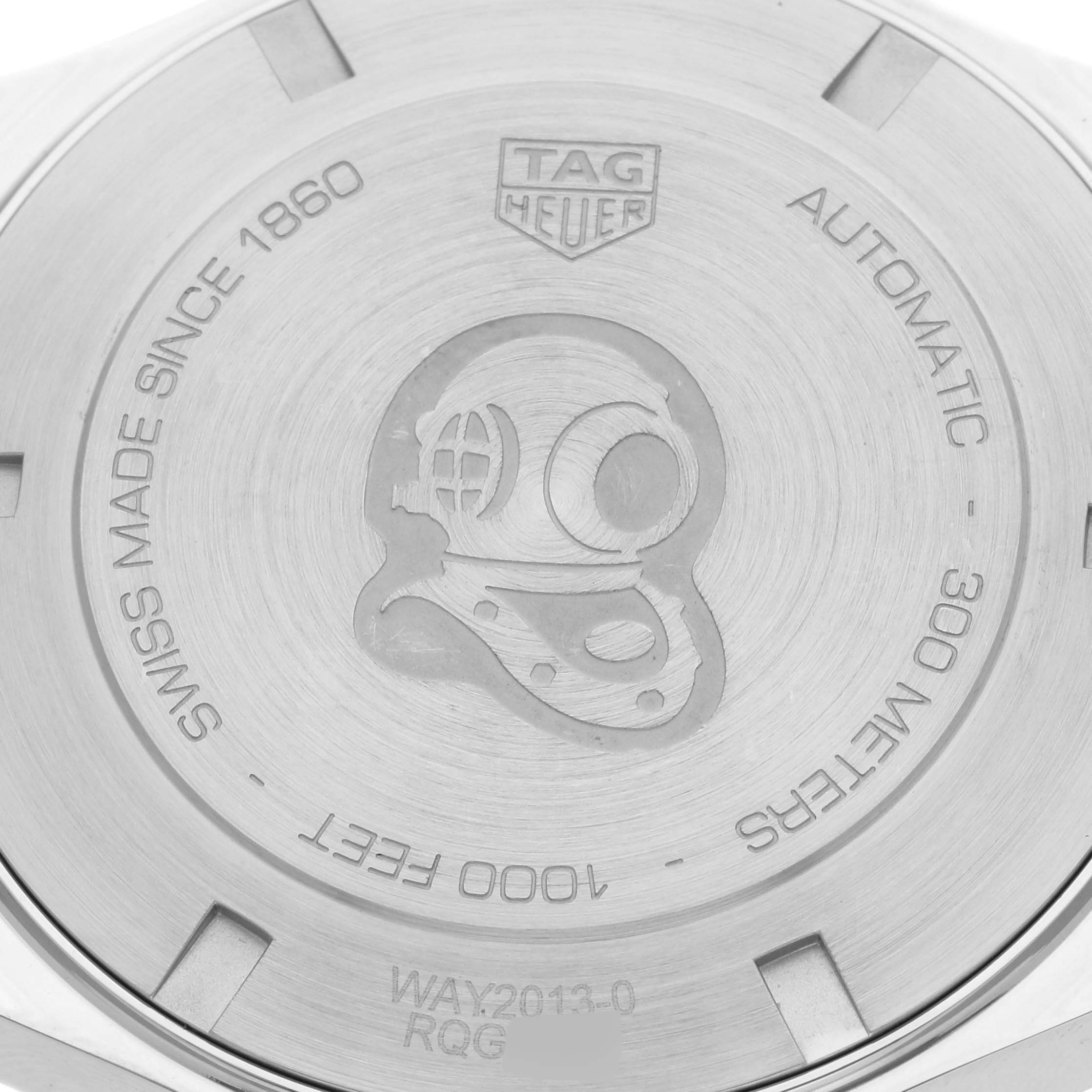 The image shows the engraved case back of a Tag Heuer Aquaracer WAY2013.BA0927 Men's Stainless Steel White Dial WAY2013.BA0927 Men's Stainless Steel White Dial watch, highlighting the diver motif and specifications.