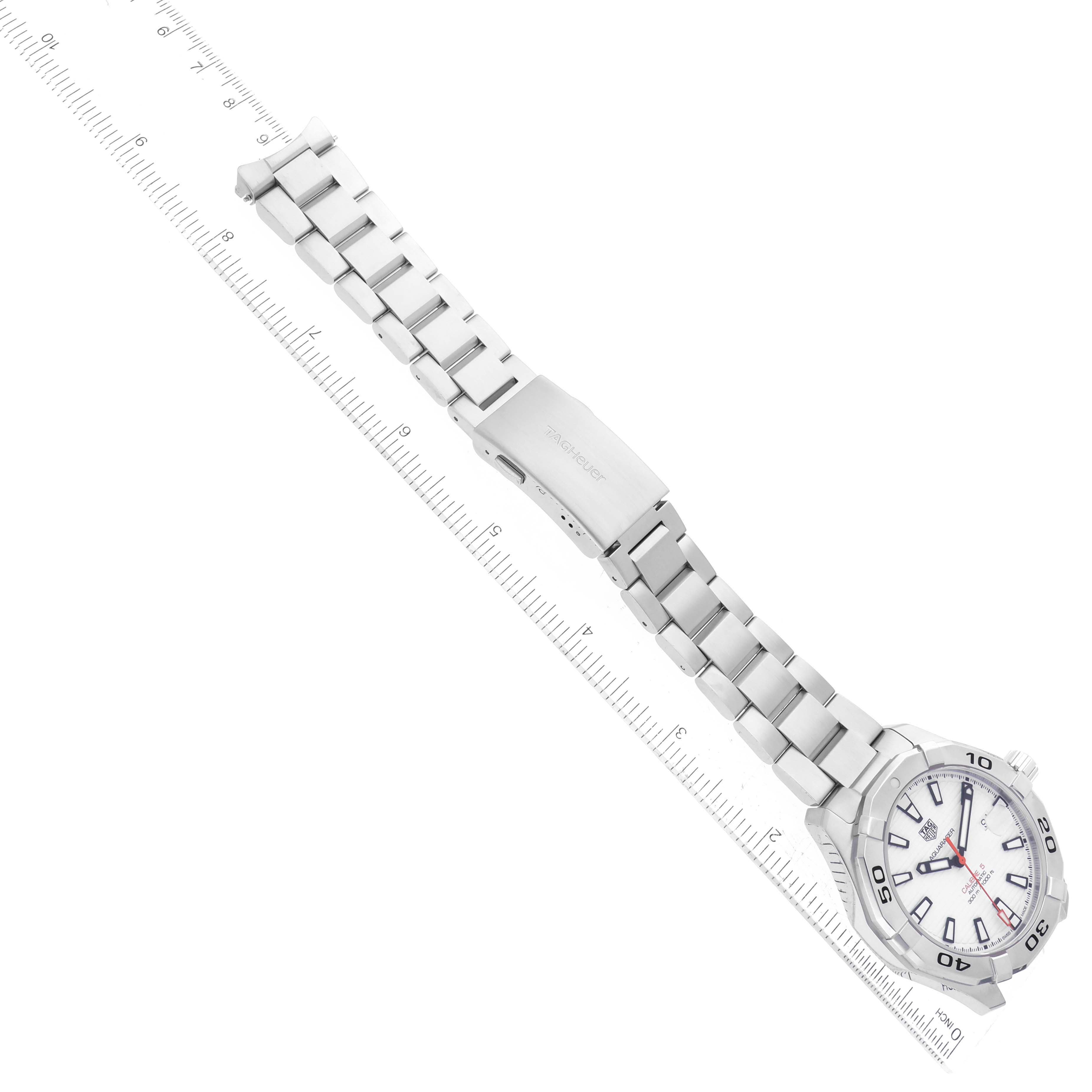 This Tag Heuer Aquaracer WAY2013.BA0927 Men's Stainless Steel White Dial WAY2013.BA0927 Men's Stainless Steel White Dial watch is shown from an angled top-down view, featuring the full stainless steel bracelet and the face.