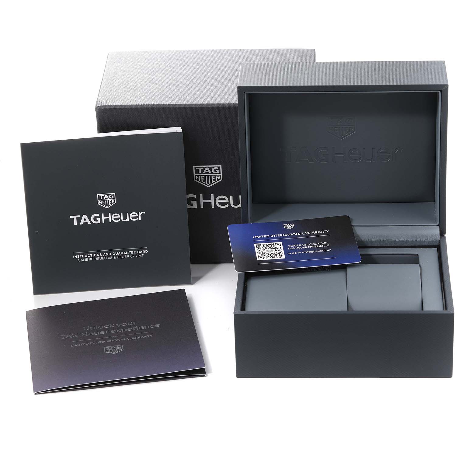 The image shows the packaging of a Tag Heuer Carrera CBG2A11.BA0654 Men's Stainless Steel Blue Dial CBG2A11.BA0654 Men's Stainless Steel Blue Dial watch, including the box, instructions, and warranty card.