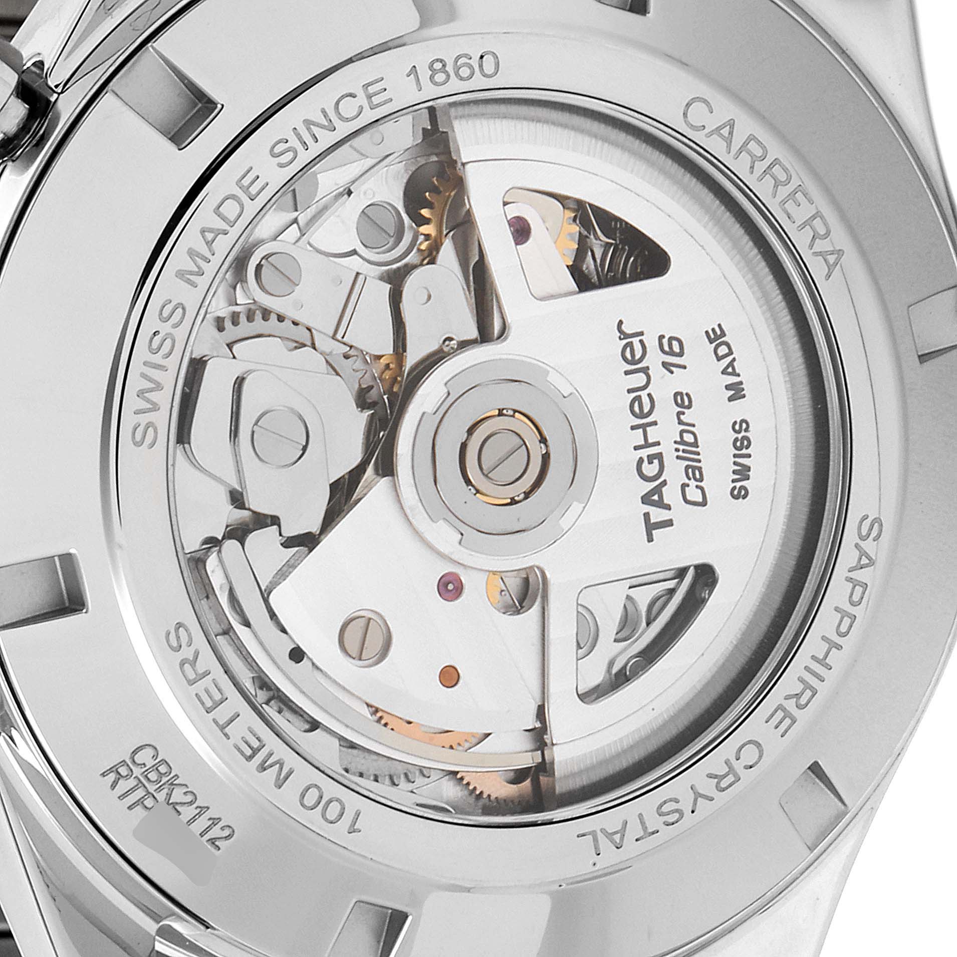The image shows the back of the Carrera model Tag Heuer watch, revealing its internal mechanical parts and movement.
