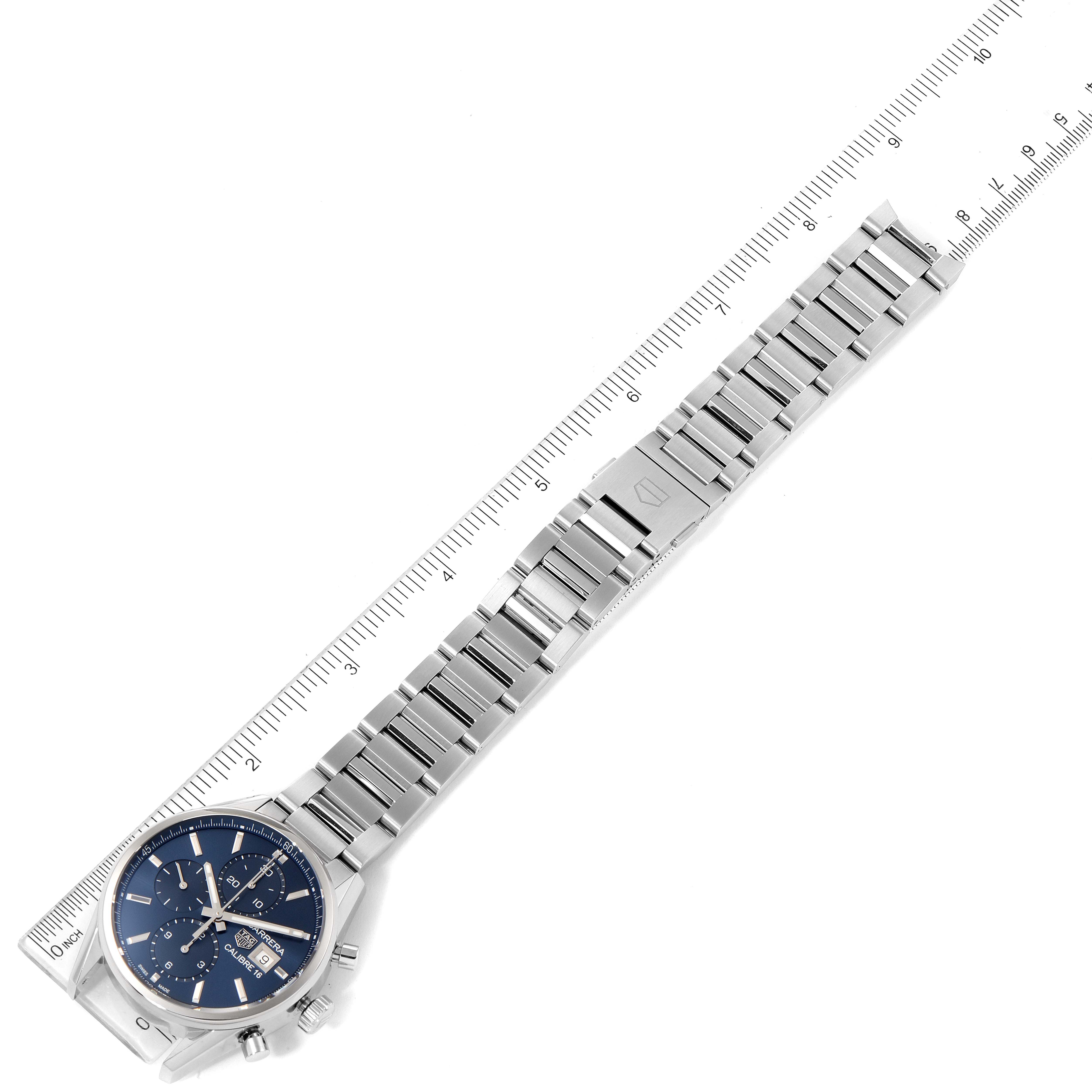 The image shows the entire Tag Heuer Carrera CBK2112.BA0715 Men
s Stainless Steel Blue Dial CBK2112.BA0715 Men
s Stainless Steel Blue Dial model watch bracelet laid flat, including the face, case, and clasp, with a ruler for scale.