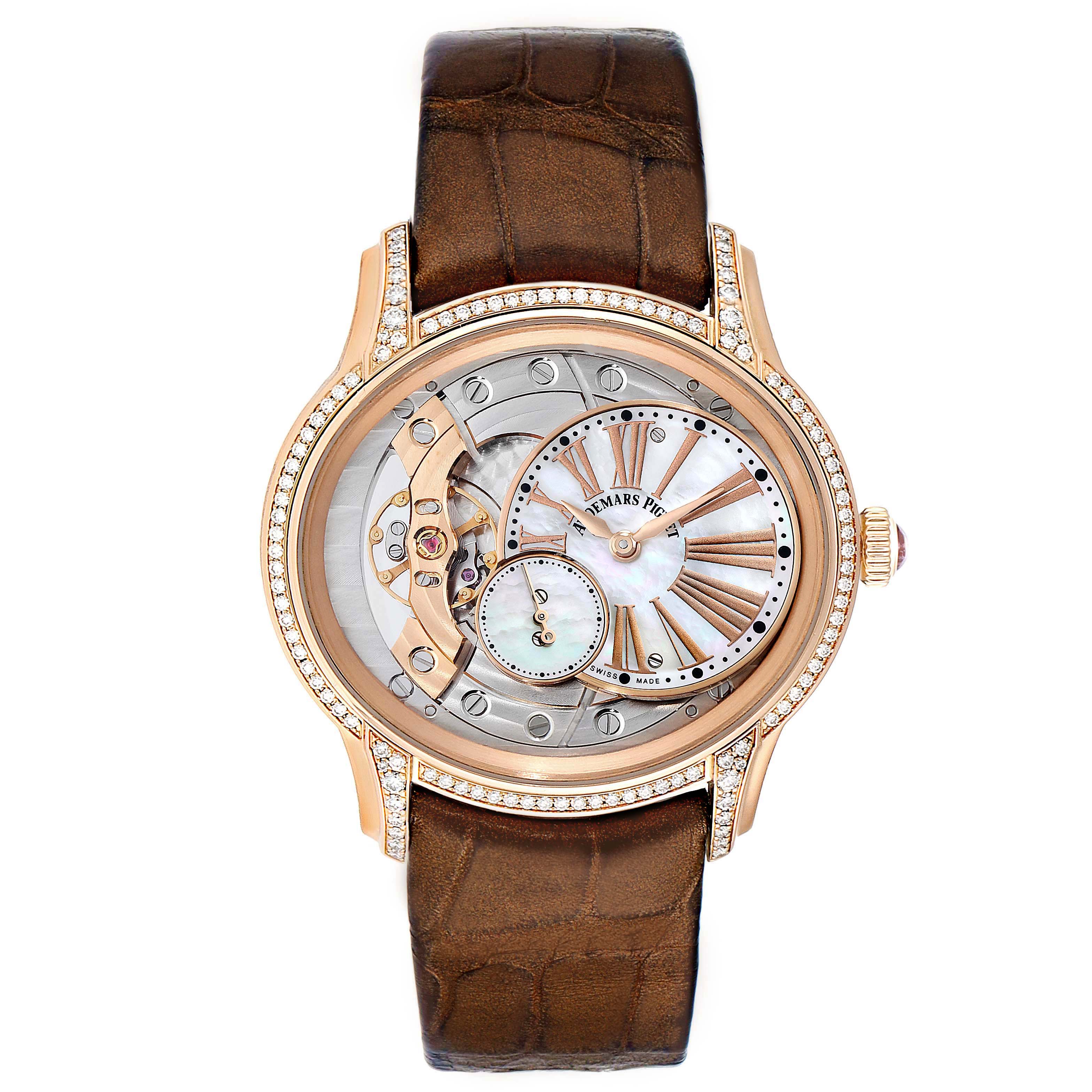 The photo shows a front view of an Audemars Piguet Millenary 77247OR.ZZ.1272OR.01 Women's Rose Gold Mother of Pearl Dial 77247OR.ZZ.1272OR.01 Women's Rose Gold Mother of Pearl Dial watch with a brown strap and a detailed, partially open dial.